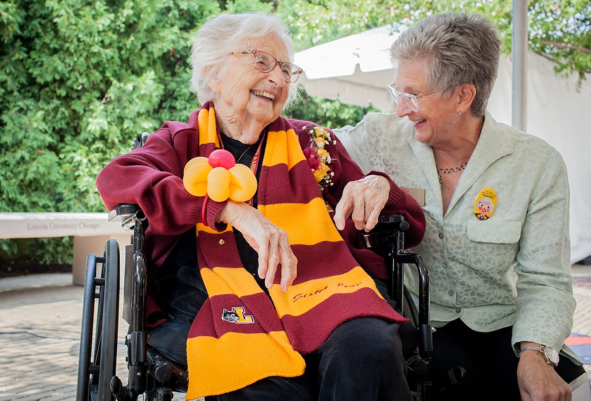Loyola University Chicago President Jo Ann Rooney and  Sister Jean Dolores Schmidt converse before a ceremony celebrating Sr. Jean's 103rd birthday and her longtime commitment to the Loyola community, by renaming the Loyola CTA plaza, 