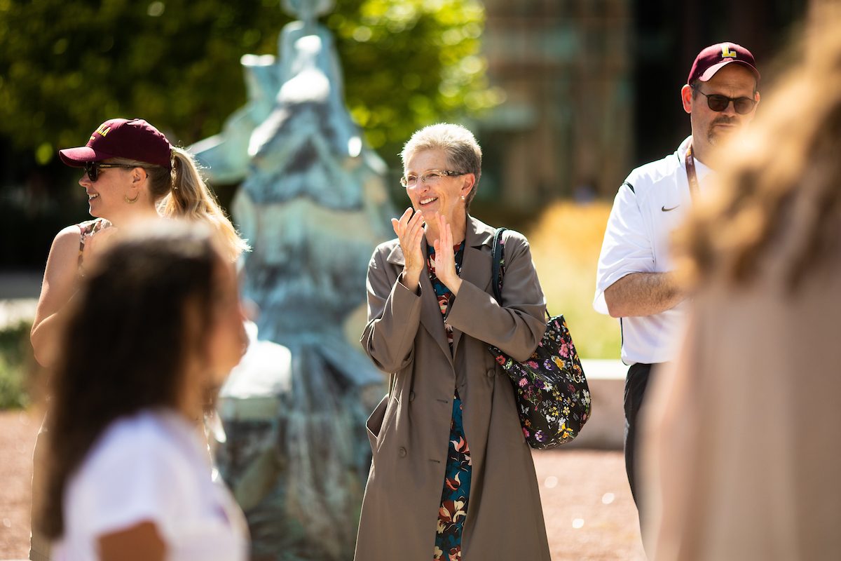 Loyola University Chicago President Dr. Jo Ann Rooney welcomes the Class of 2023 during the New Student Convocation Walk on August 23, 2019. (Photo: Lukas Keapproth)