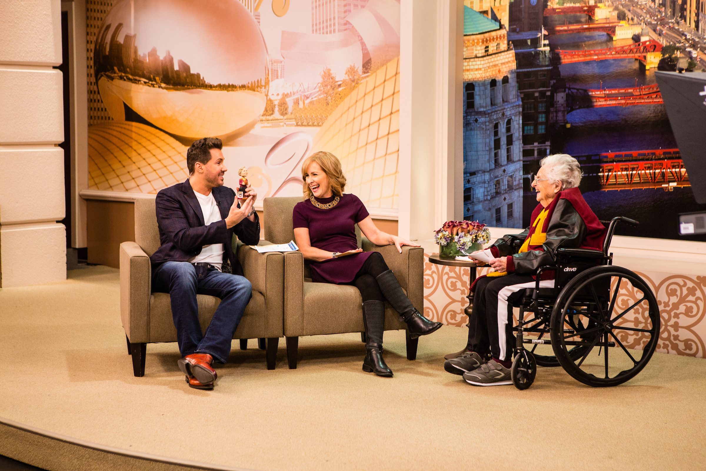 At right, Sr. Jean Dolores Schmidt, BVM, makes an appearance on Windy City Live with ABC7's Tracy Butler and co-host Ryan Chiaverini on March 12, 2018, to discuss the Loyola University Chicago men's basketball team and her basketball bracket. As the Loyola men's basketball team chaplain, Sr. Jean plans to attend the first NCAA championship game on March 15 in Dallas. (Photo: Heather Eidson)