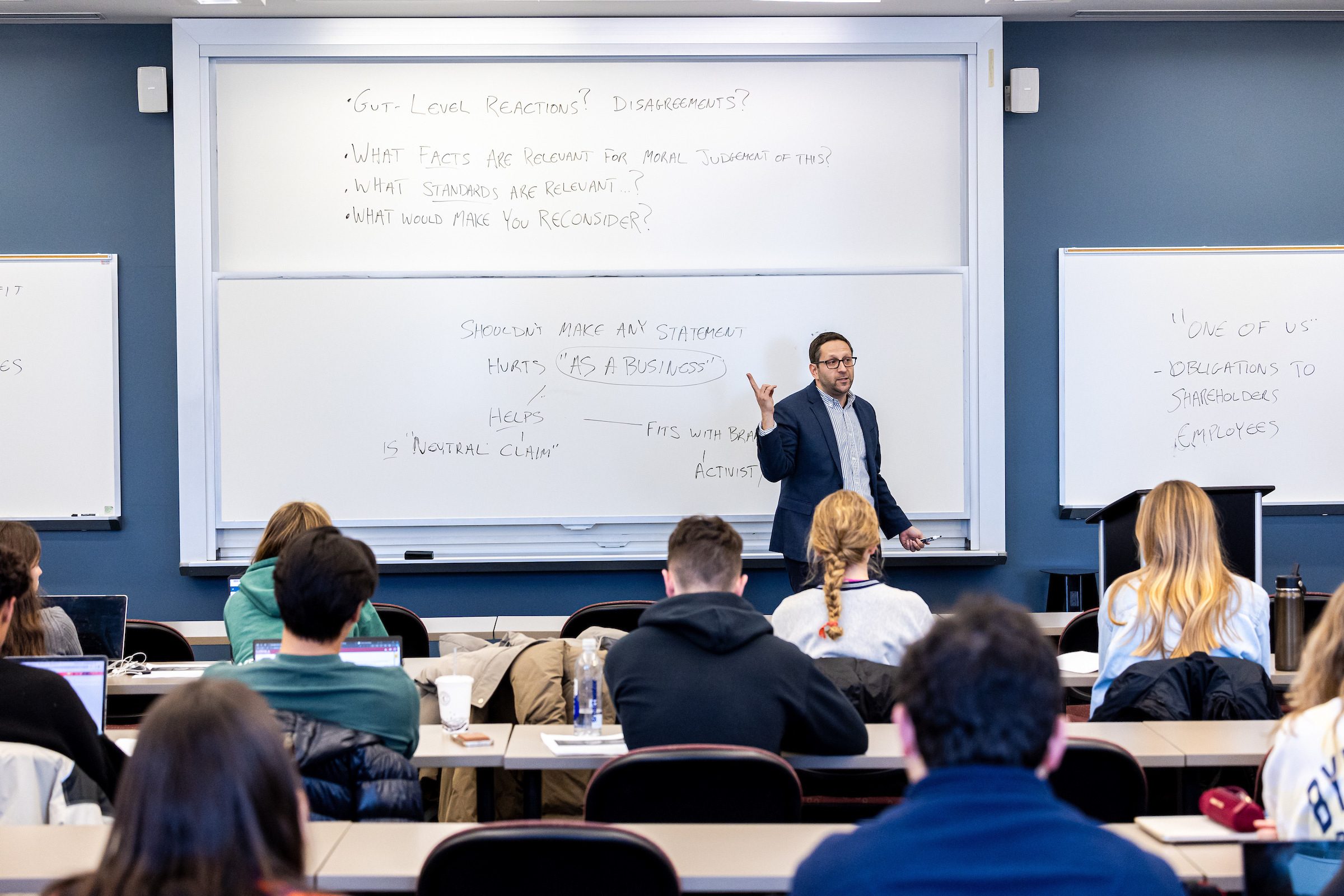 Quinlan School of Business Professor Abe Singer teaches a business ethics course on January 18, 2024. (Photo by: Lukas Keapproth)