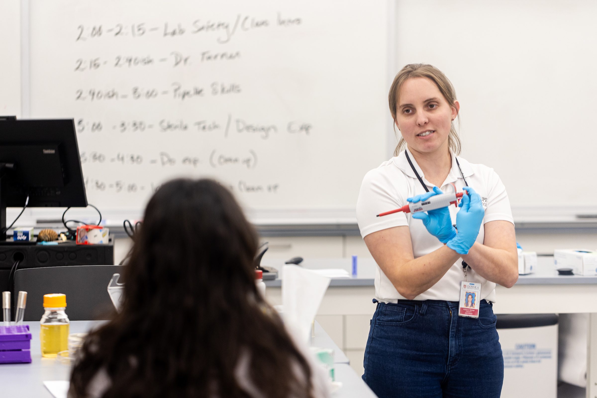 Arrupe College students learn pipetting techniques in the Arrupe Science Lab on January 18, 2024. (Photo by: Lukas Keapproth)