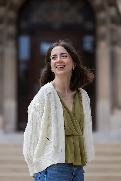 A portrait of Kelly Fahrendorf smiling outdoors on Loyola University Chicago's campus