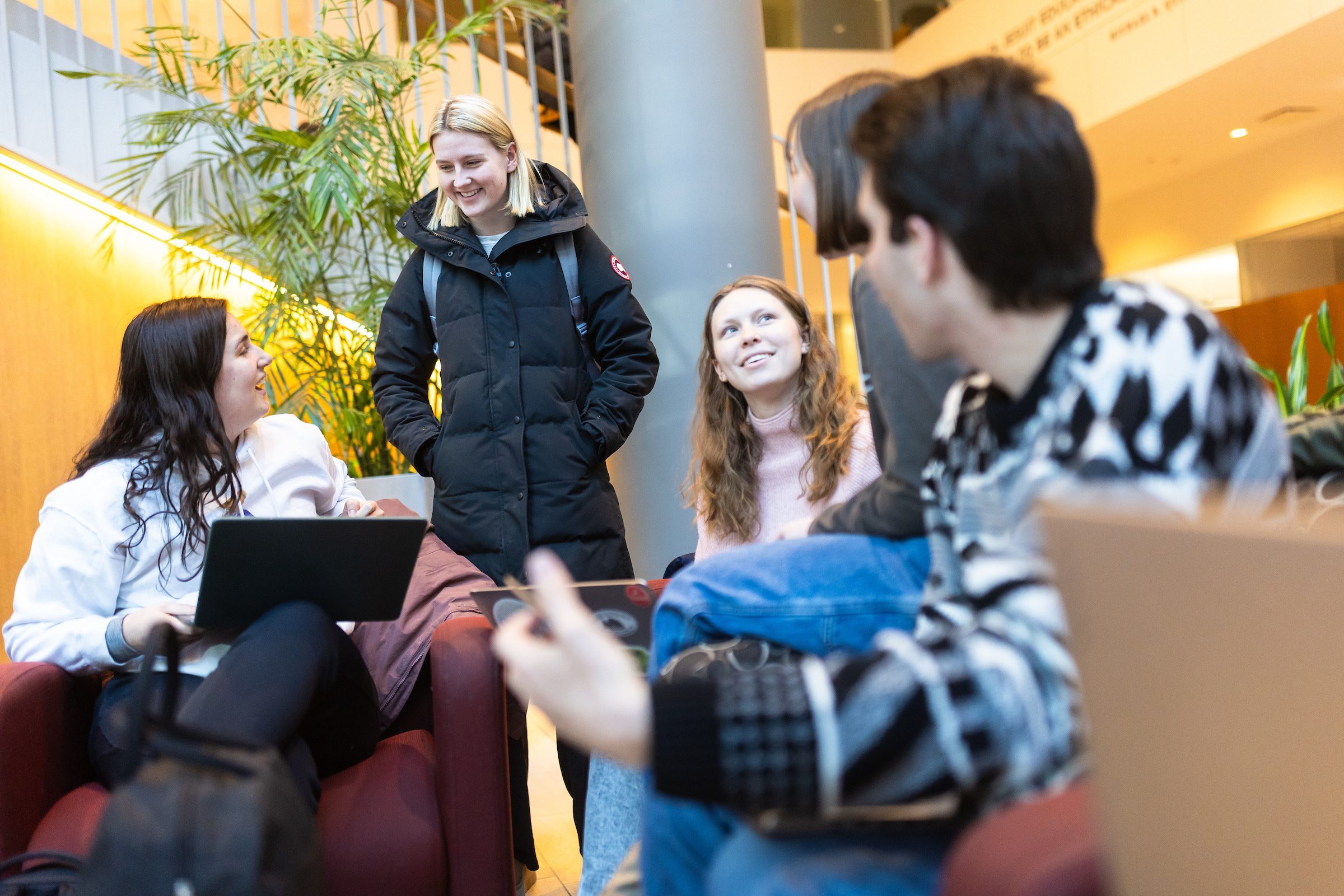 Loyola business students hang out in the Schreiber building during the first week of classes during the spring 2024 semester. (Photo by: Lukas Keapproth)