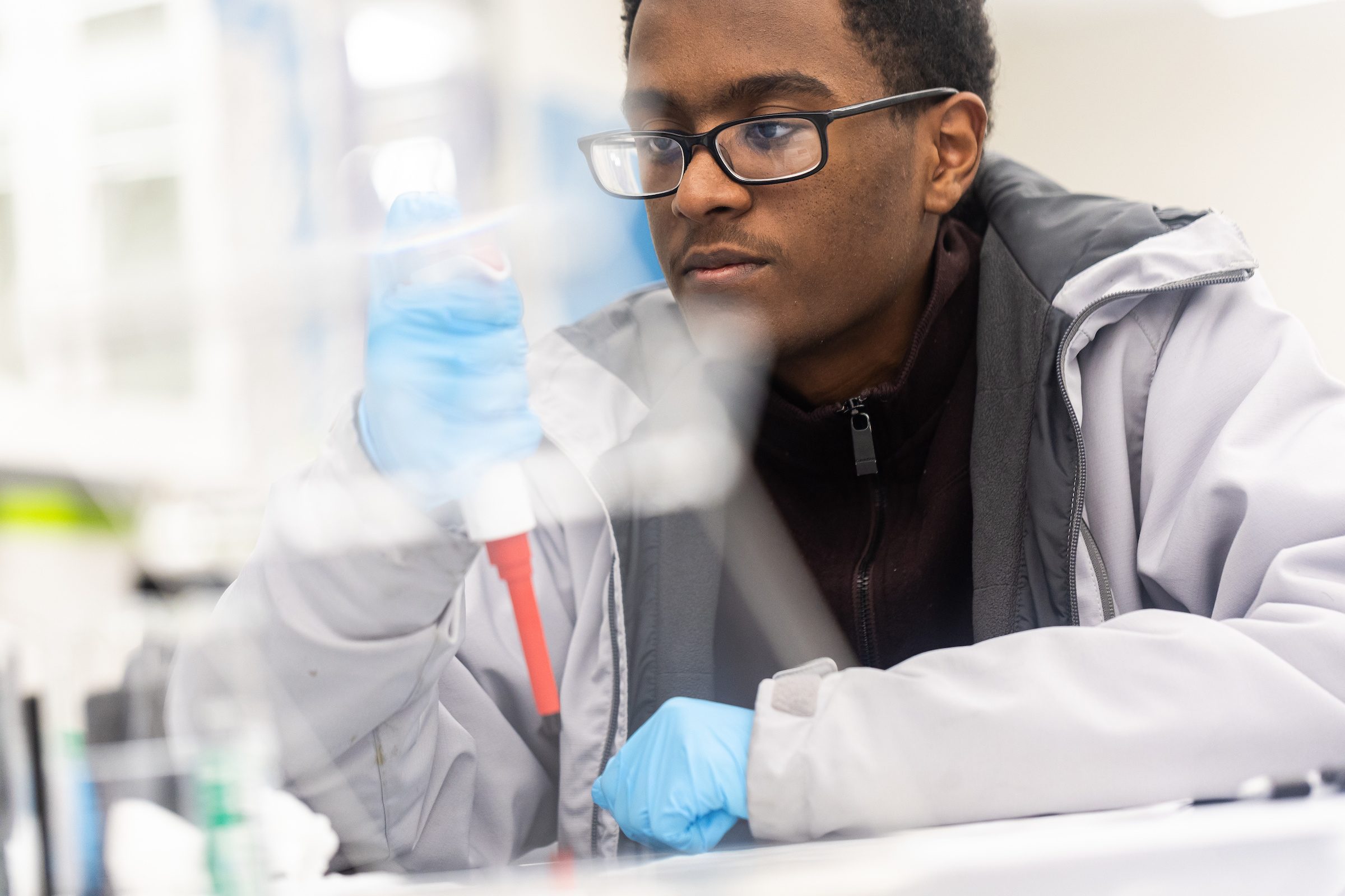 Arrupe College students learn pipetting techniques in the Arrupe Science Lab on January 18, 2024. (Photo by: Lukas Keapproth)