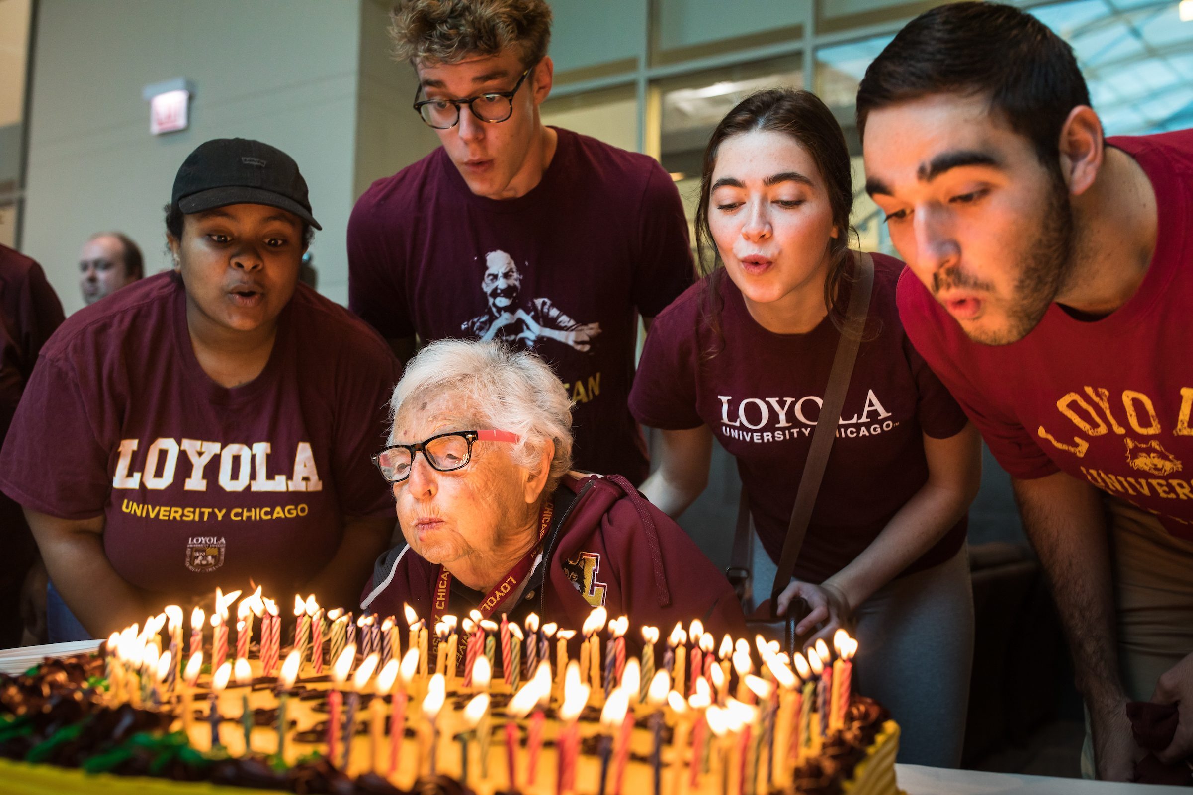 Sister Jean Dolores Schmidt celebrates her 99th birthday by blowing out 99 birthday candles with the help of students from Loyolacapella, a Loyola acapella group. The celebration took place in the Damen Stduent Center on Tuesday, August 21, 2018. (Photo: Lukas Keapproth)