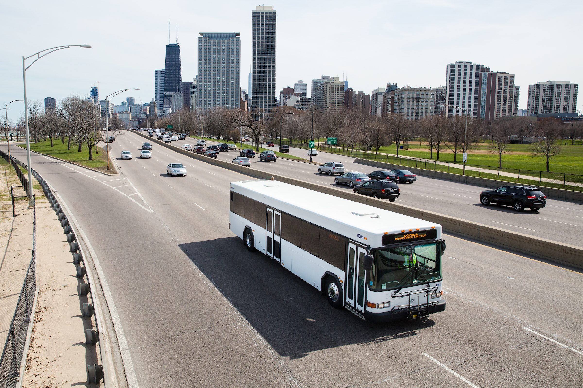 The Loyola Intercampus Shuttle Bus drives along Lake Shore Drive en route from Water Tower Campus to Lake Shore Campus on April 25, 2018. The bus uses biodiesel fuel made from the Searle Biodiesel Lab on the Lake Shore Campus. Part of Sustainability Series. (Photo: Lukas Keapproth)