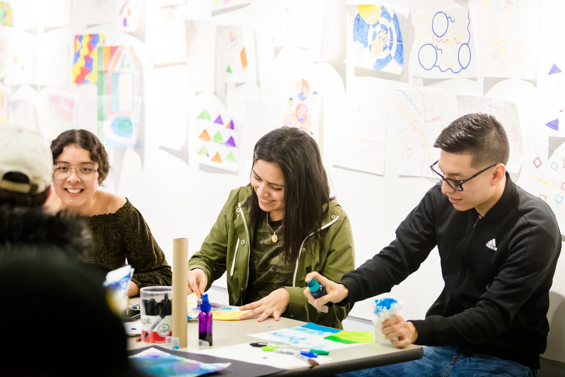 Arrupe College students work on art projects in classroom