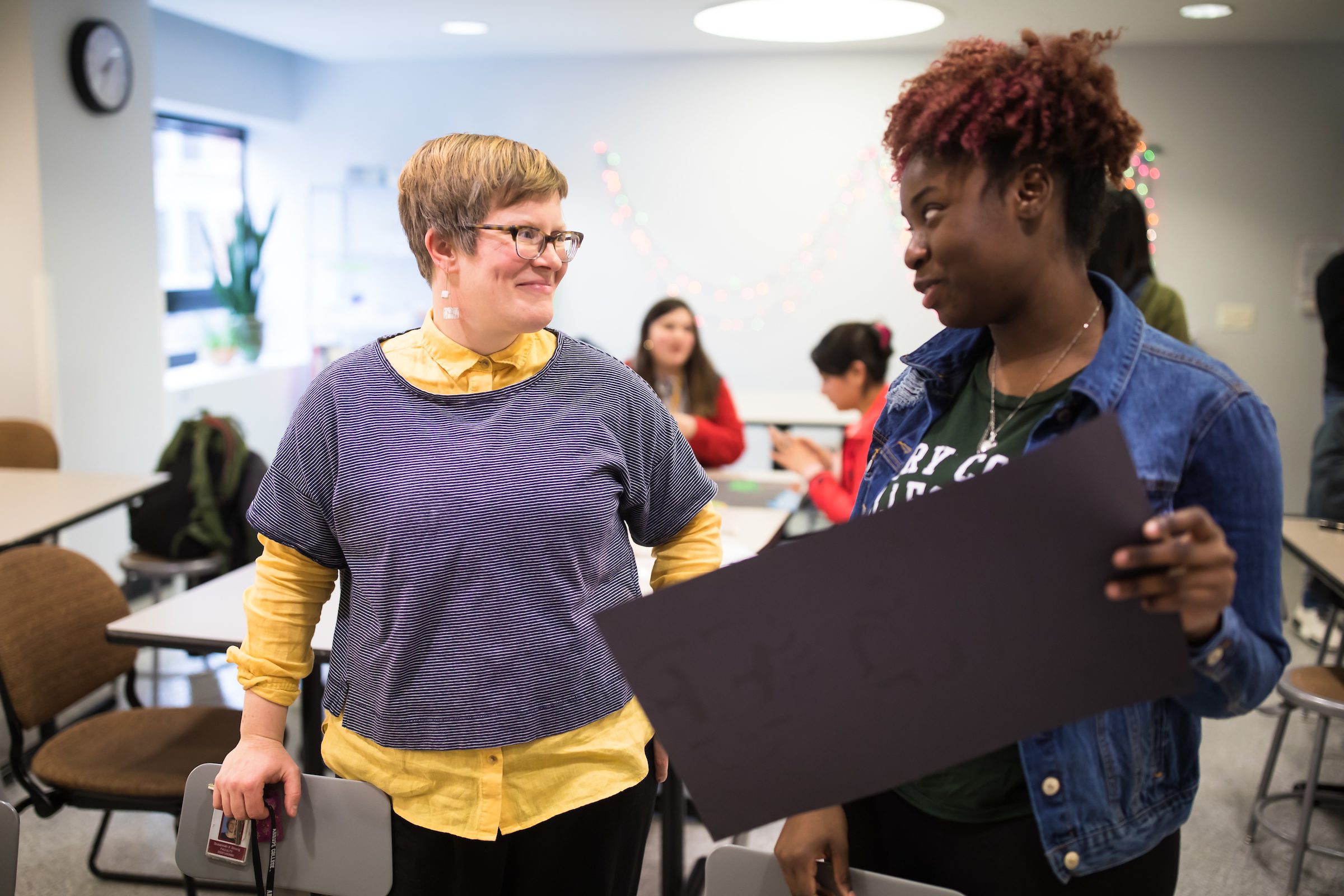 Arrupe College Professor Susannah Kite Strang works with Arrupe students on their art projects in Maguire Hall on February 29, 2019. This year Arrupe College celebrates their second collaboration with the Loyola University Museum of Art. Student projects individually developed out of class will be featured, alongside photographs and 2-dimensional work from Arrupe’s inaugural Foundation Studio/2D-Design class. This exhibition will be curated by Susannah Kite Strang, professor at Arrupe College.(Photo: Lukas Keapproth)