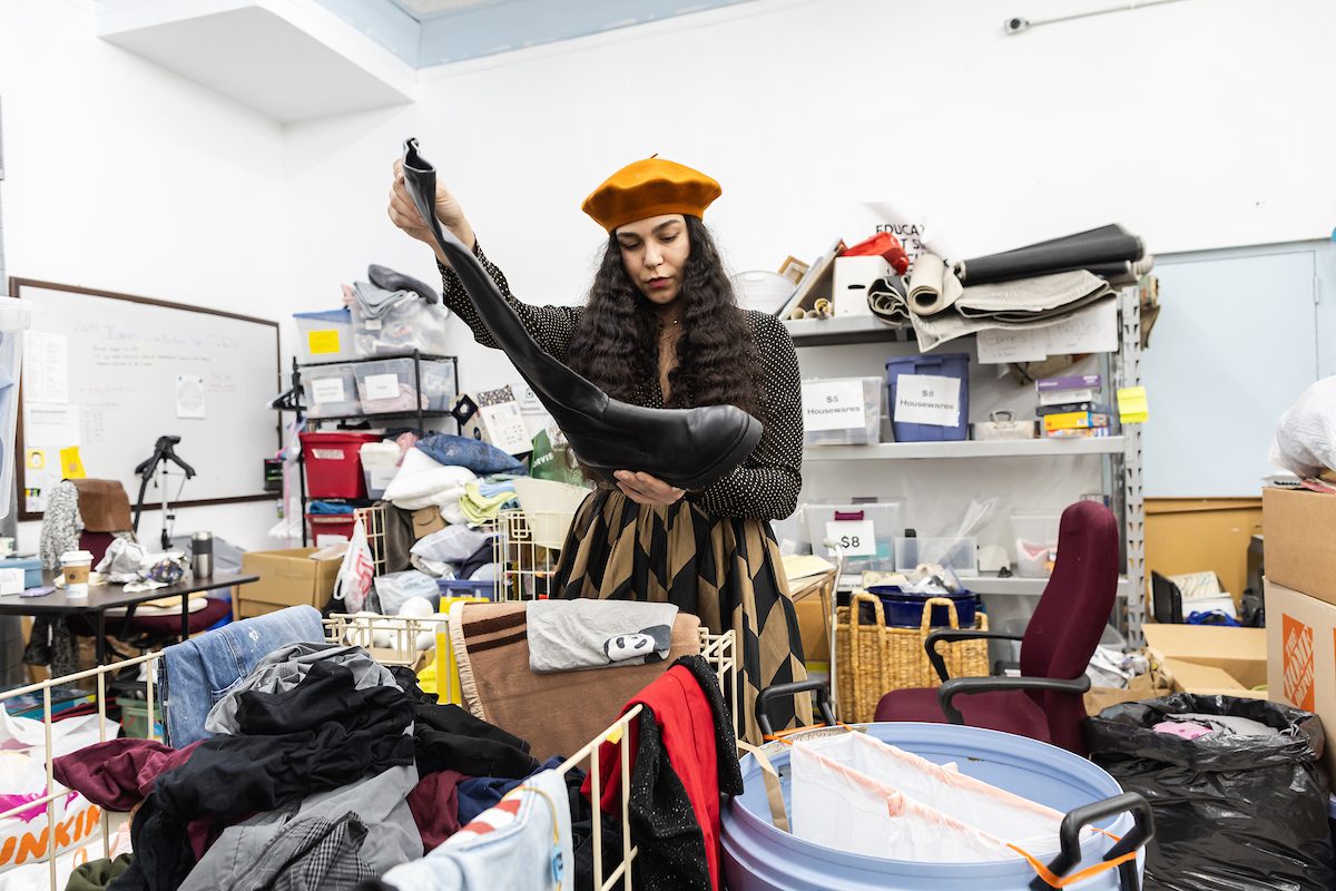 Sheyssa Rosado sorts through clothing items at Monarch Thrift Shop. (Photo: Lukas Keapproth)