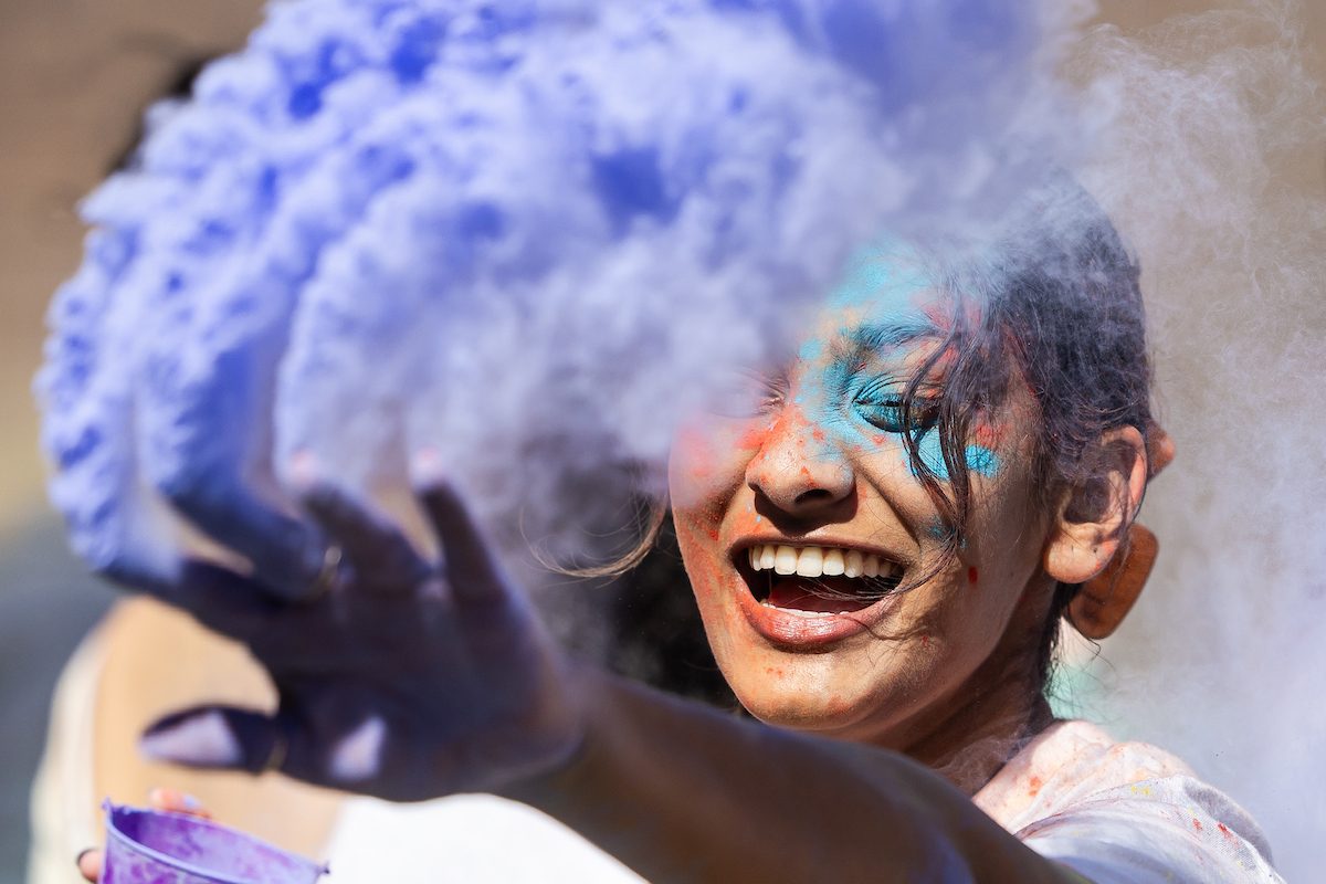 Students throw colored powder on each other as part of the celebration of Holi, a Hindu holiday marking the arrival of spring. The Hindu Student Association hosted the event in the Winthrop Play Lot in partnership with Campus Ministry. 
