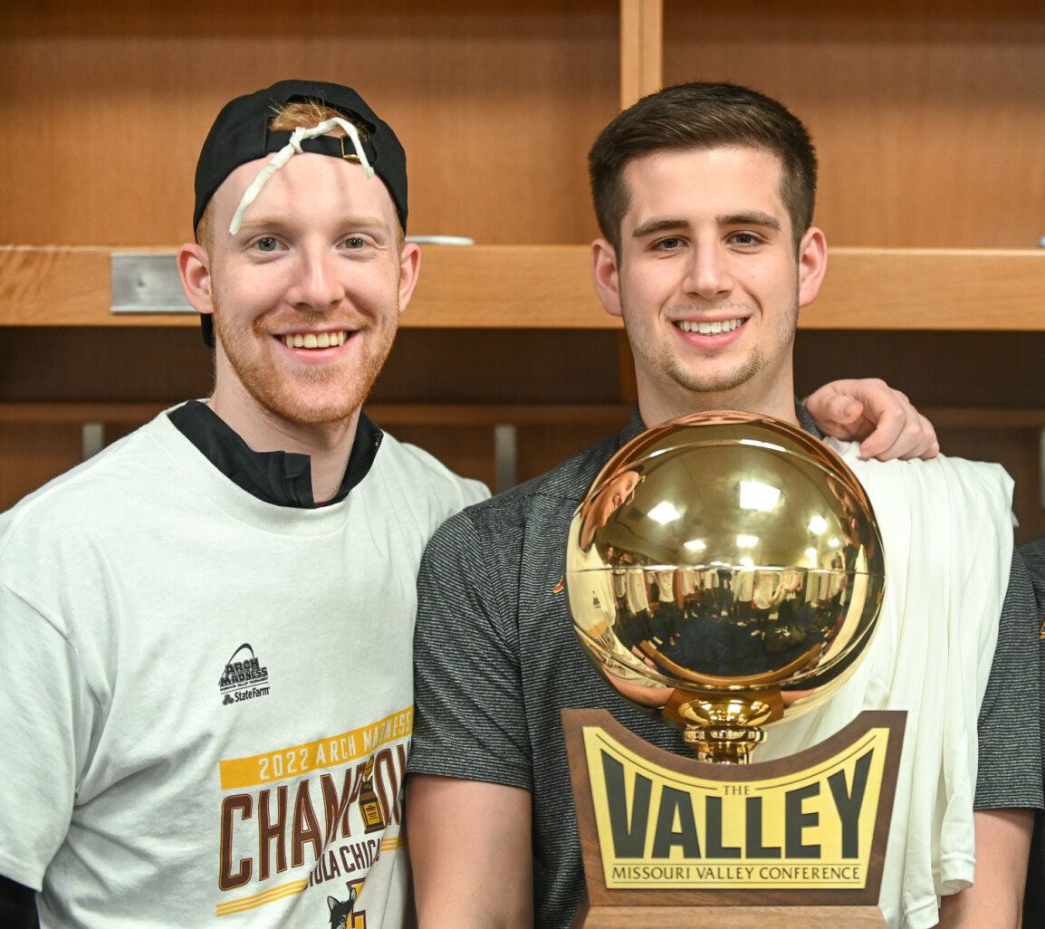 Sheils and Raedle pictured with the 2022 Missouri Valley Conference tournament trophy. 