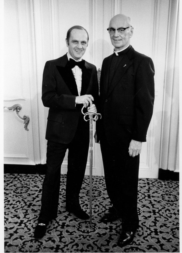 Bob Newhart receiving the Sword of Loyola in 1975, pictured with former Loyola President James Maguire, S.J.