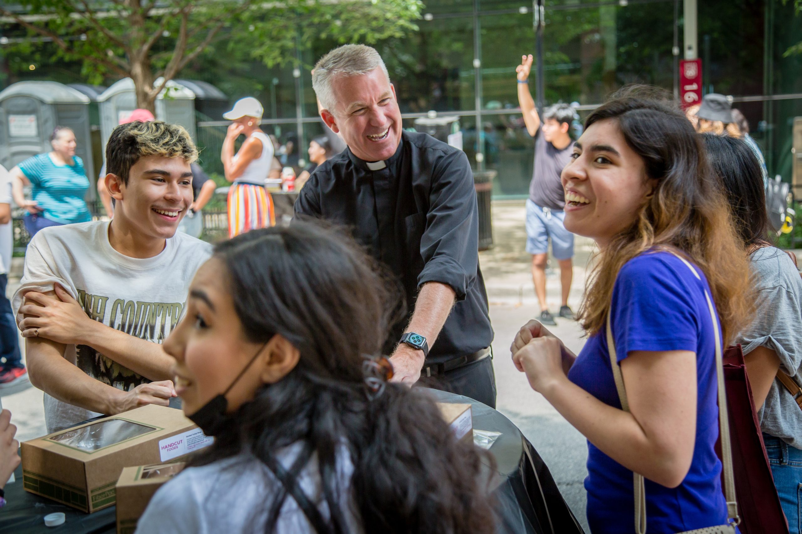 Students, staff and faculty enjoy summer fun and food while at the Arrupe College Meet and Greet Block Party on Pearson Street, July 14, 2021.The event celebrated incoming freshmen and outgoing sophomores. (Photo: Natalie Battaglia)