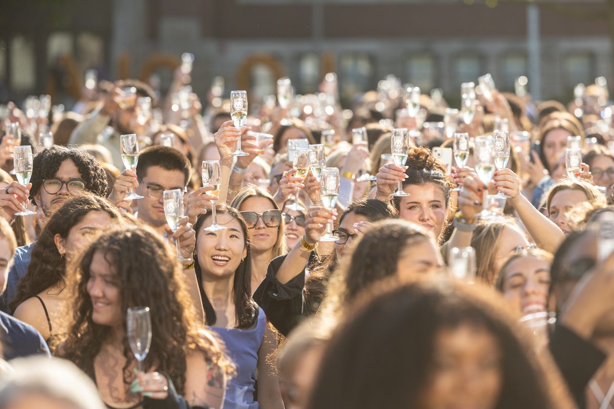 The Class of 2024 raises a glass as they join the ranks of Loyola's newest alumni. 