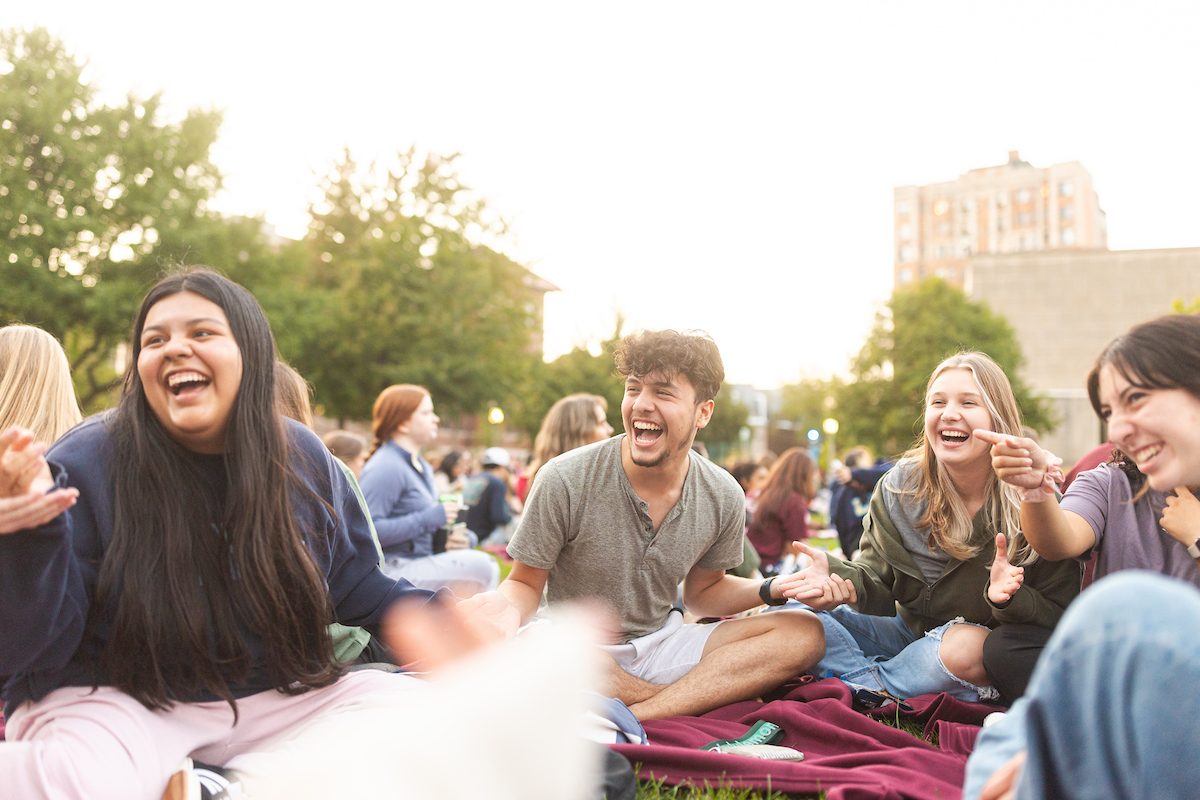 Loyola University Chicago students attend Movie on the Quad as part of Welcome Week festivities, August 21, 2024. (Photo by: Lukas Keapproth)