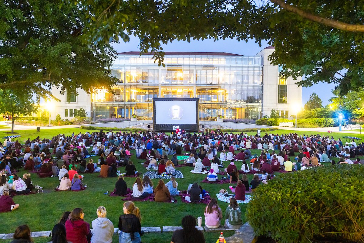 Loyola University Chicago students attend Movie on the Quad as part of Welcome Week festivities, August 21, 2024. (Photo by: Lukas Keapproth)