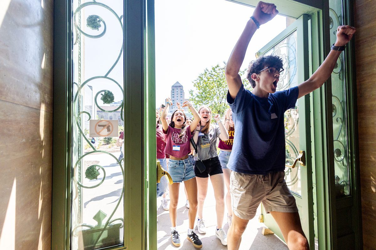 The Loyola University Chicago community welcomes the Class of 2028 during the New Student Convocation Walk on August 23, 2024. (Photo by: Lukas Keapproth)