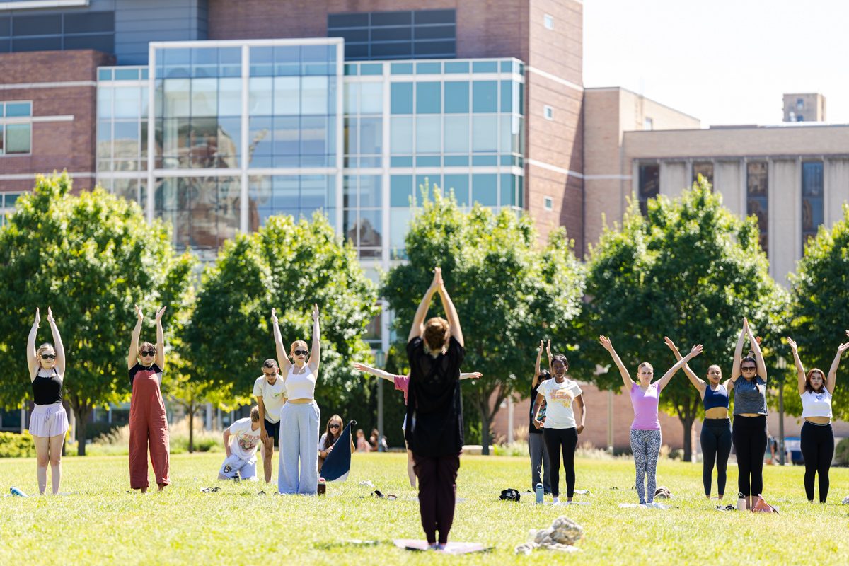 Loyola University Chicago students practice yoga during Yoga on the Quad during Welcome Week, August 31, 2024. (Photo by: Lukas Keapproth)