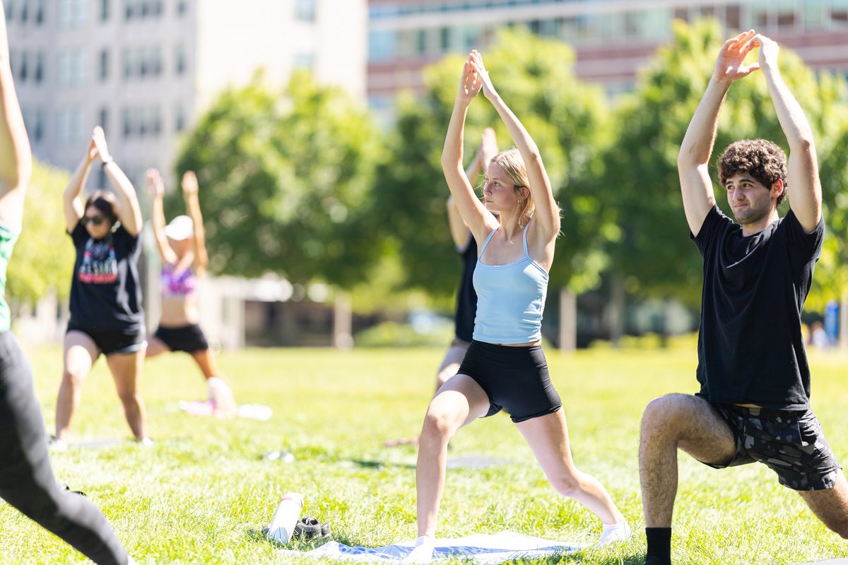 Loyola University Chicago students practice yoga during Yoga on the Quad during Welcome Week, August 31, 2024. (Photo by: Lukas Keapproth)