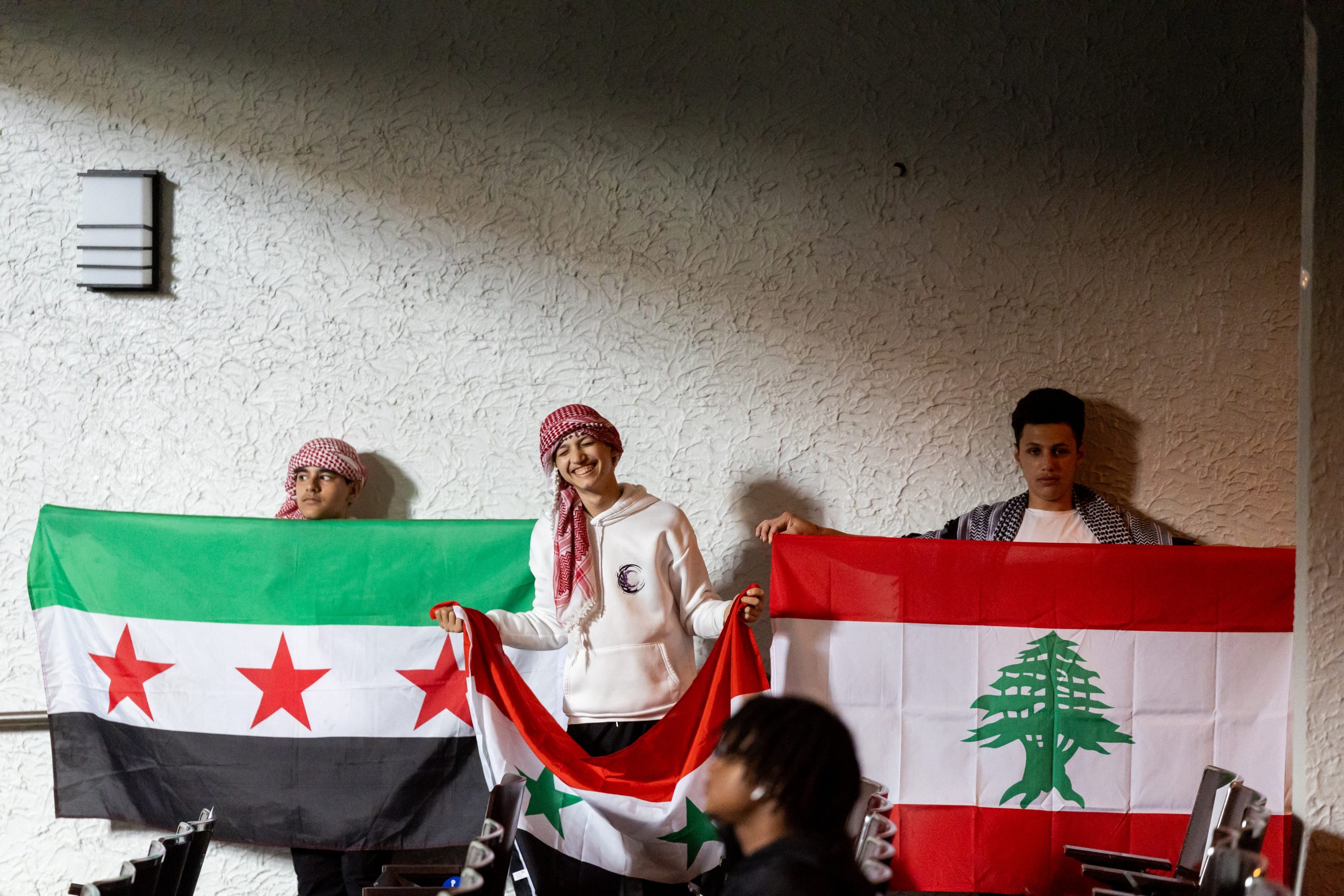 Sullivan High School students hold up flags for their countries