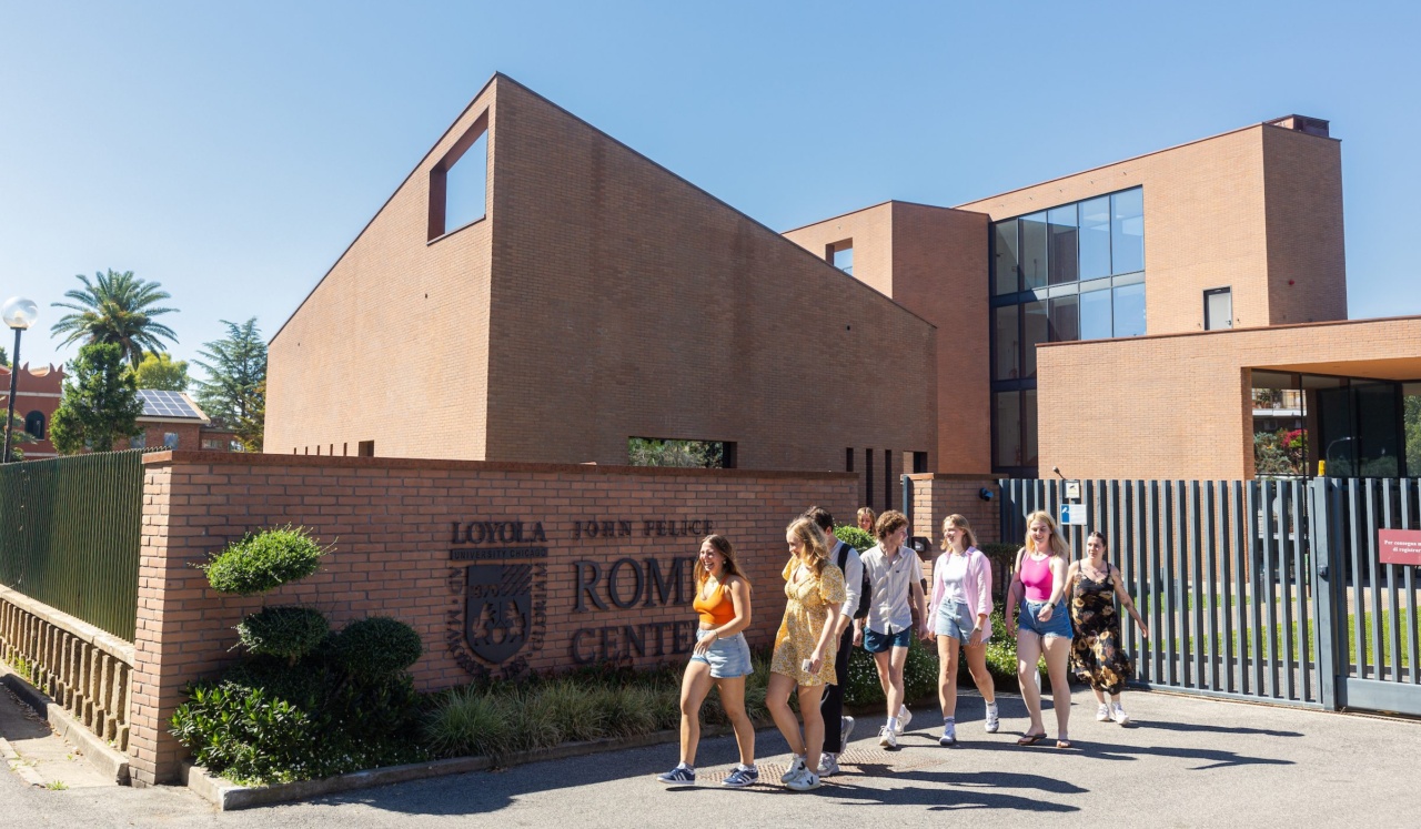 A group of Loyola University Chicago student walk out the front gate of the John Felice Rome Center