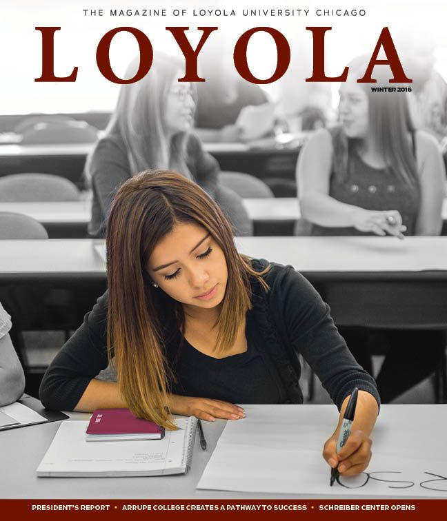 A Loyola University Chicago student takes notes in a classroom with other students in the background on this cover of Loyola magazine