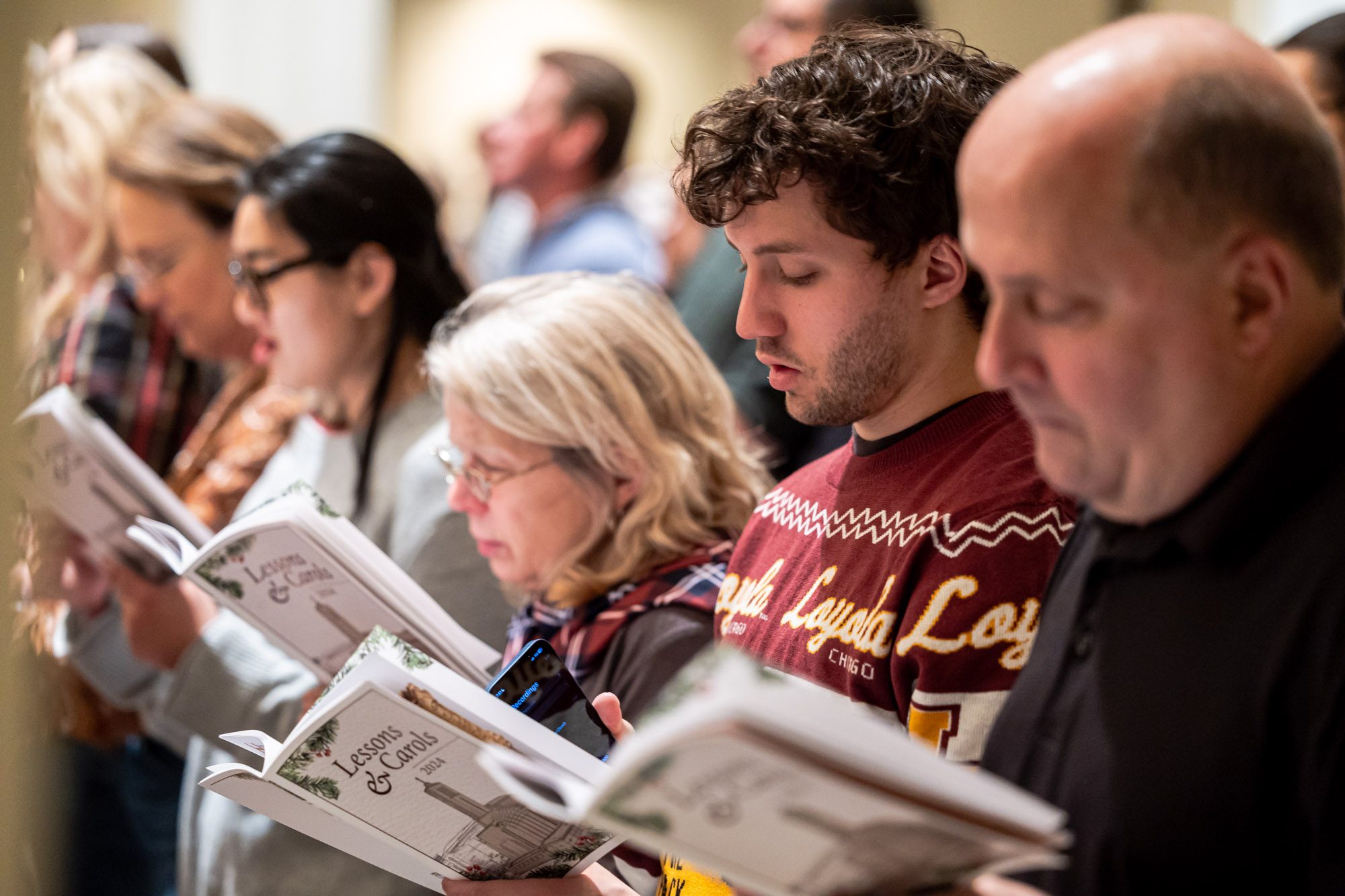 The Loyola chorus ensemble performs at Lessons and Carols, a holiday service that combines scripture readings with liturgical music in Madonna Della Strada Chapel, December 7, 2024. (Photo: Lukas Keapproth)