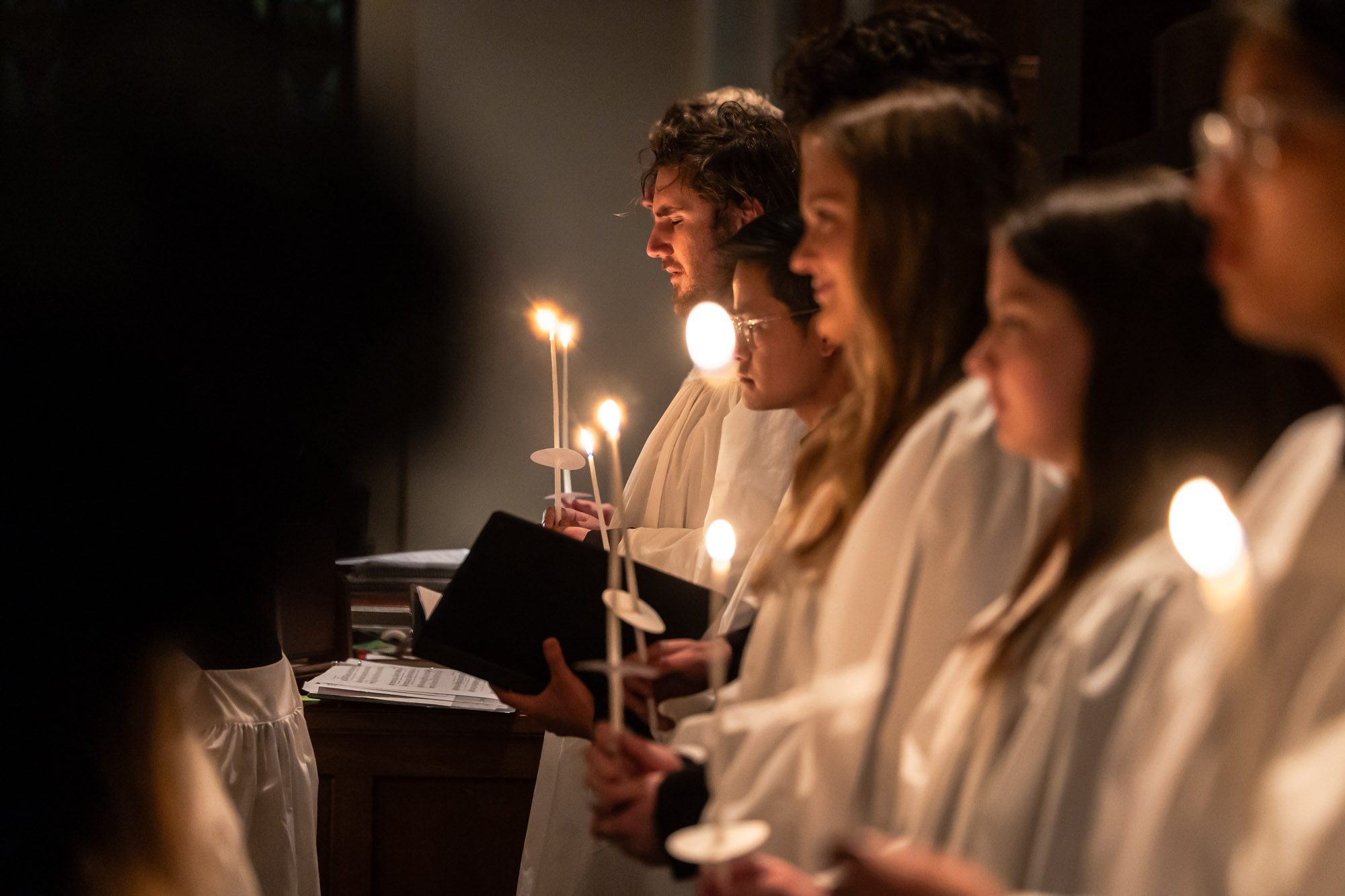 The Loyola chorus ensemble performs at Lessons and Carols, a holiday service that combines scripture readings with liturgical music in Madonna Della Strada Chapel, December 7, 2024. (Photo: Lukas Keapproth)