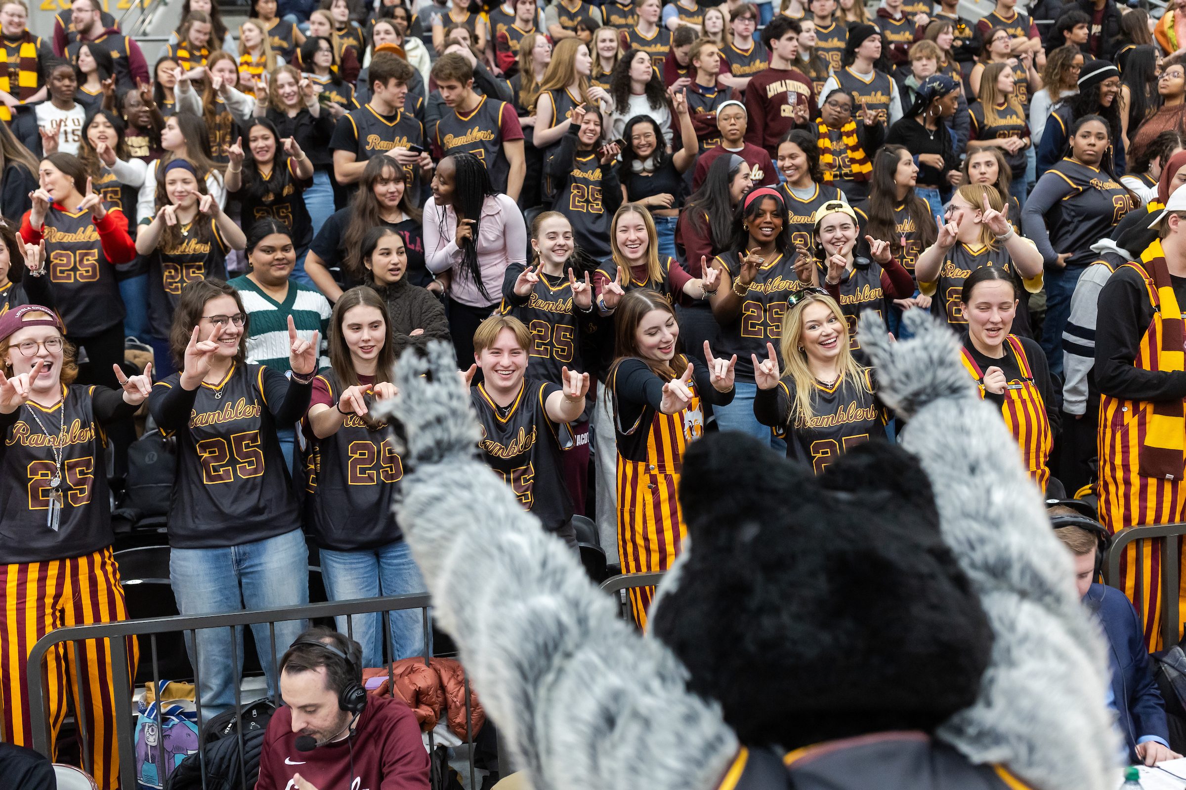 LU Wolf energizes the crowd in the student section at the Ramblers men's basketball game following Jesuit Jam on Jan. 22. Loyola University Chicago students cheer on the Ramblers men's basketball team with the help of mascot LU wolf