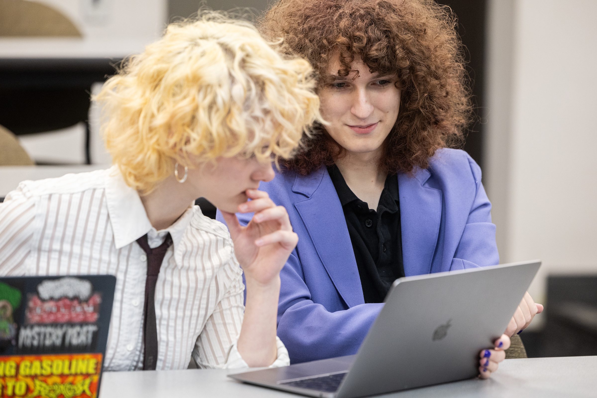 Members of the Loyola Debate Team compete at the Civic Debate Consortium’s Social Justice Debates Fall Championship, held in the Corboy Law School on November 16, 2024. (Photo: Lukas Keapproth) Two Loyola University Chicago students look at a computer screen in a classroom
