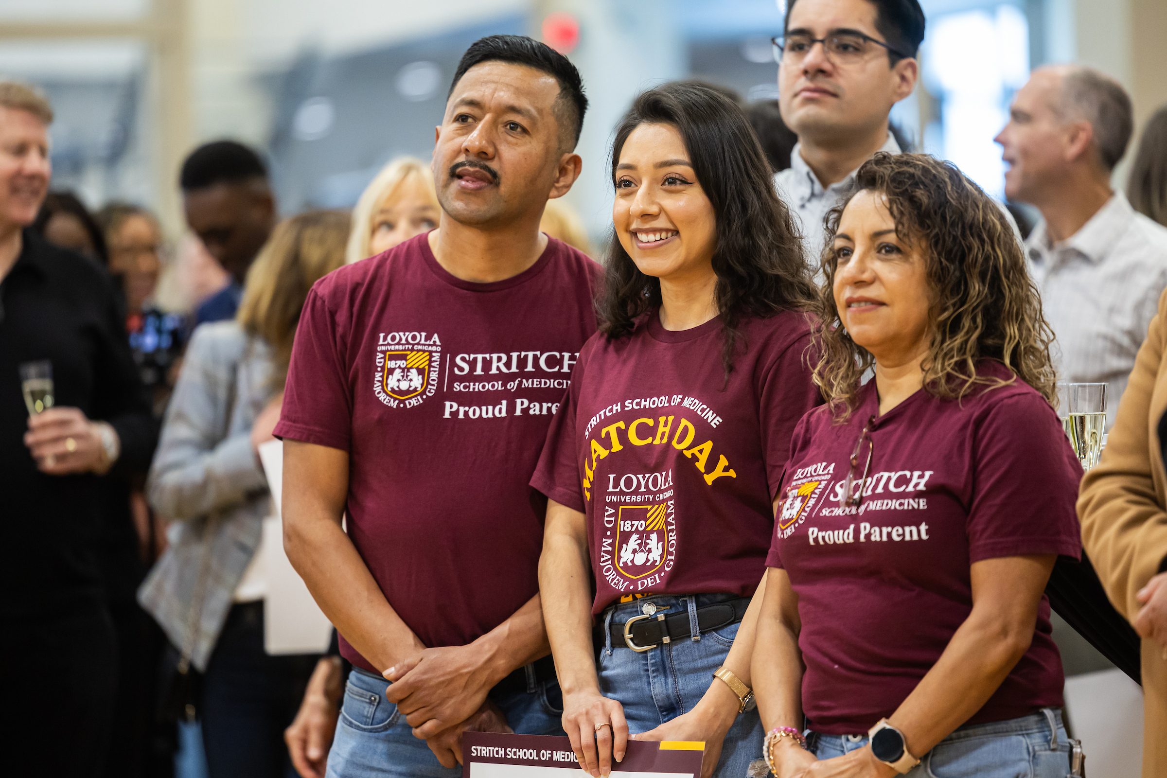 Loyola physicians-in-training react as they receive their residency matches during Loyola University Chicago Stritch School of Medicine's Match Day celebration in Maywood on Friday, March 21, 2025.(Photo by: Lukas Keapproth)
