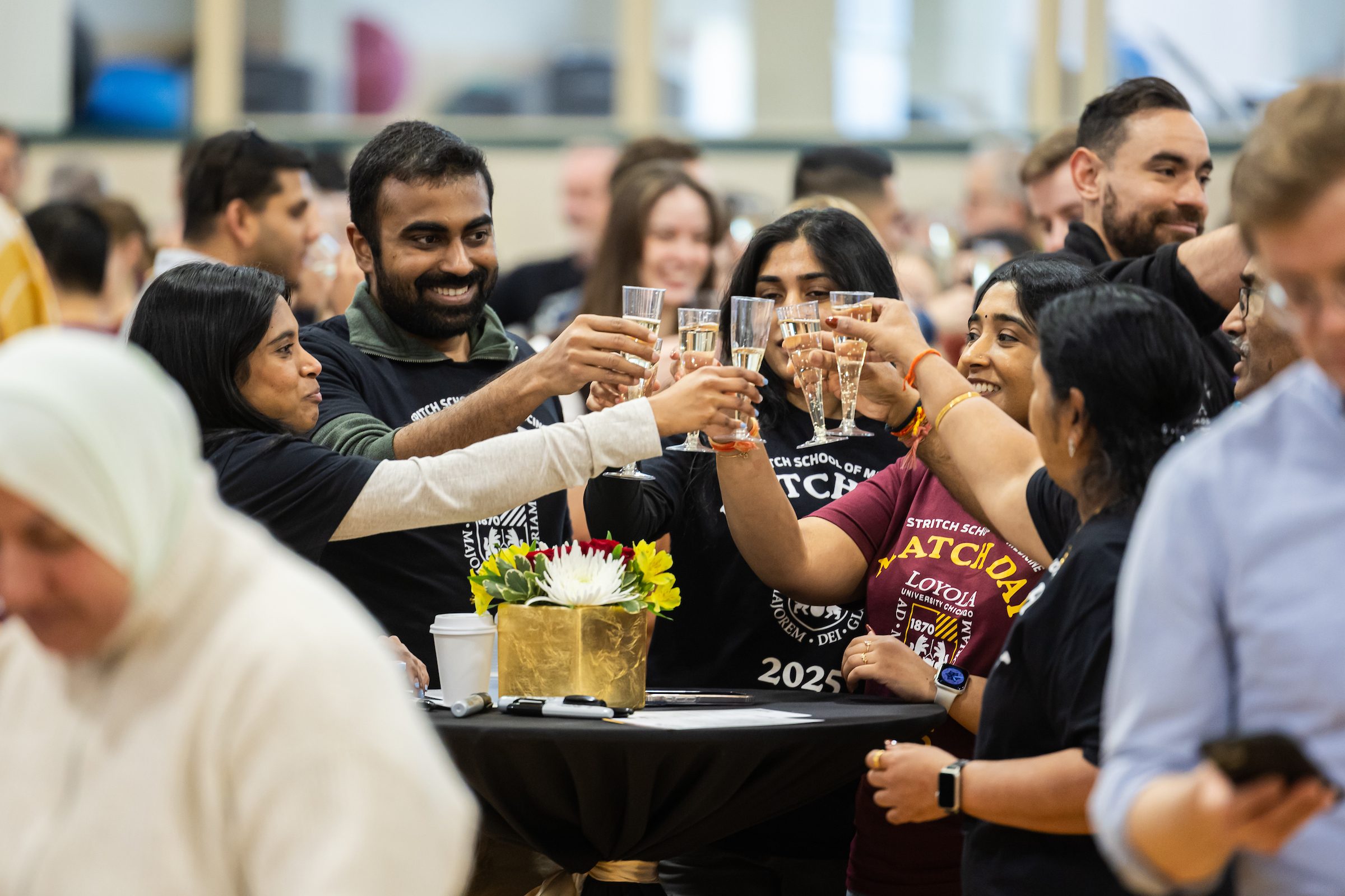 Loyola physicians-in-training react as they receive their residency matches during Loyola University Chicago Stritch School of Medicine's Match Day celebration in Maywood on Friday, March 21, 2025.(Photo by: Lukas Keapproth)
