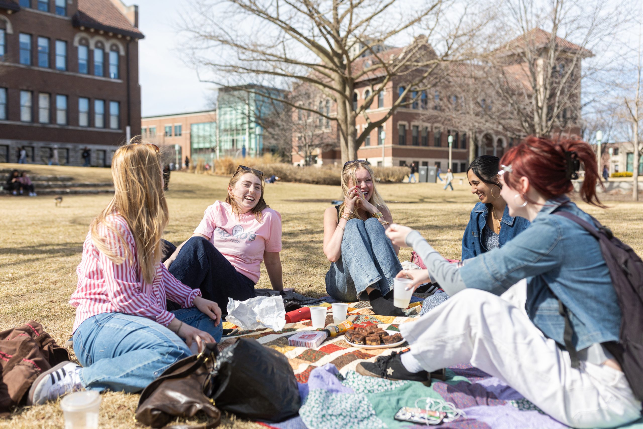 Loyola students (from left) Marlo Lange, 
Julia Nuble, 
Delaney Frank, 
Natasha Chohan, and 
Norah Flannery celebrate Nuble's birthday on a warm March day on the East Quad. 