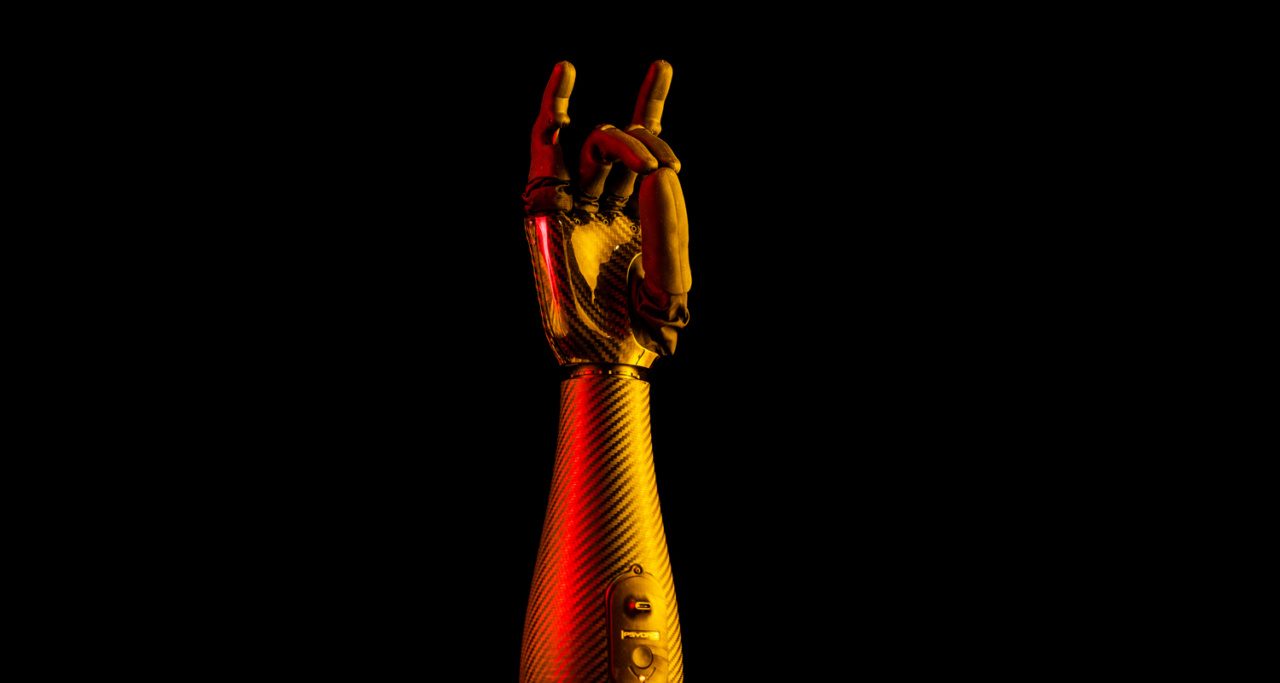 PYSONIC's Ability Hand with Loyola's maroon and gold colors projected on it.