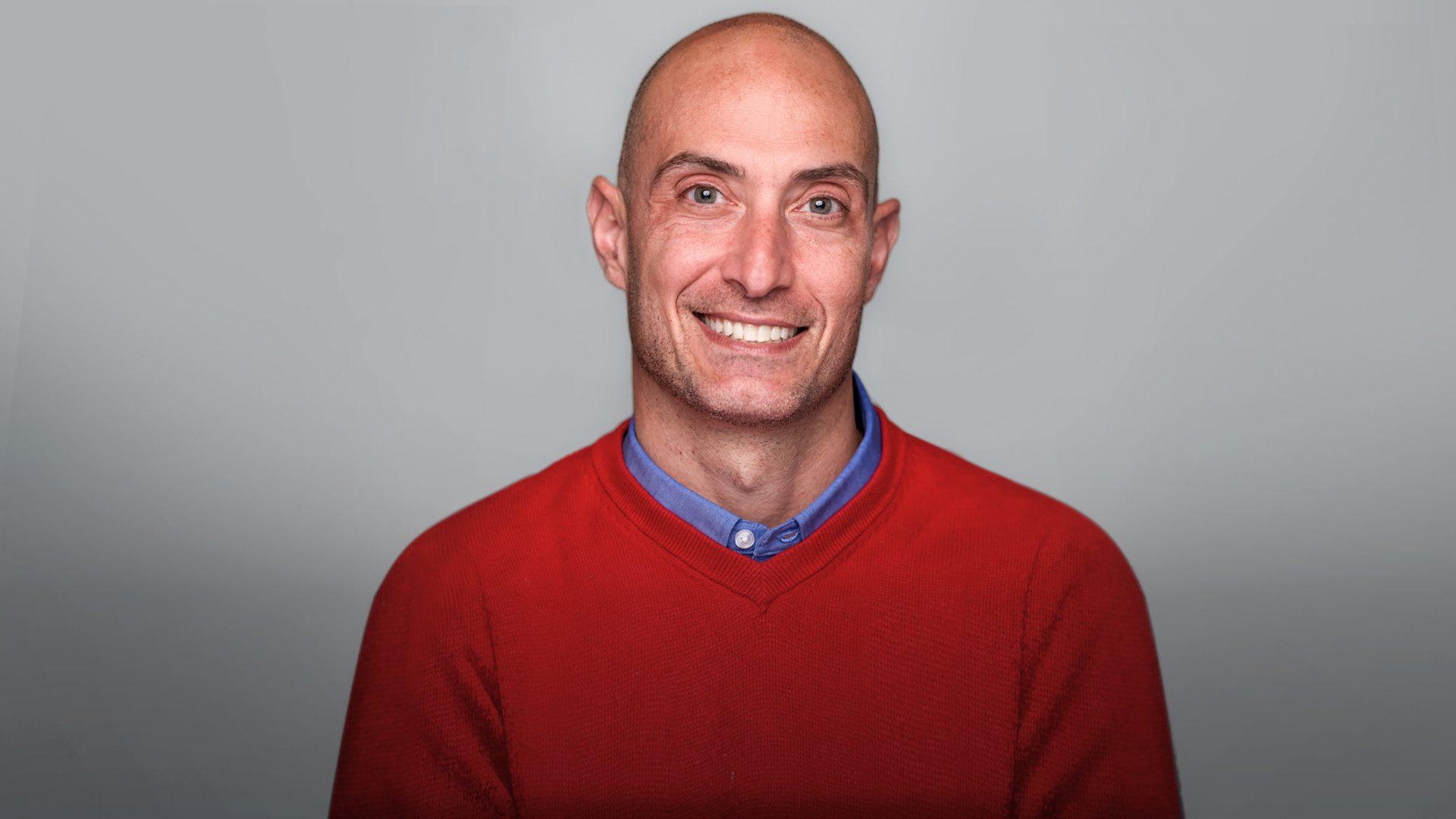 Luigi Amendola, appointed vice president for University Advancement at Loyola University Chicago, appears in a red sweater.