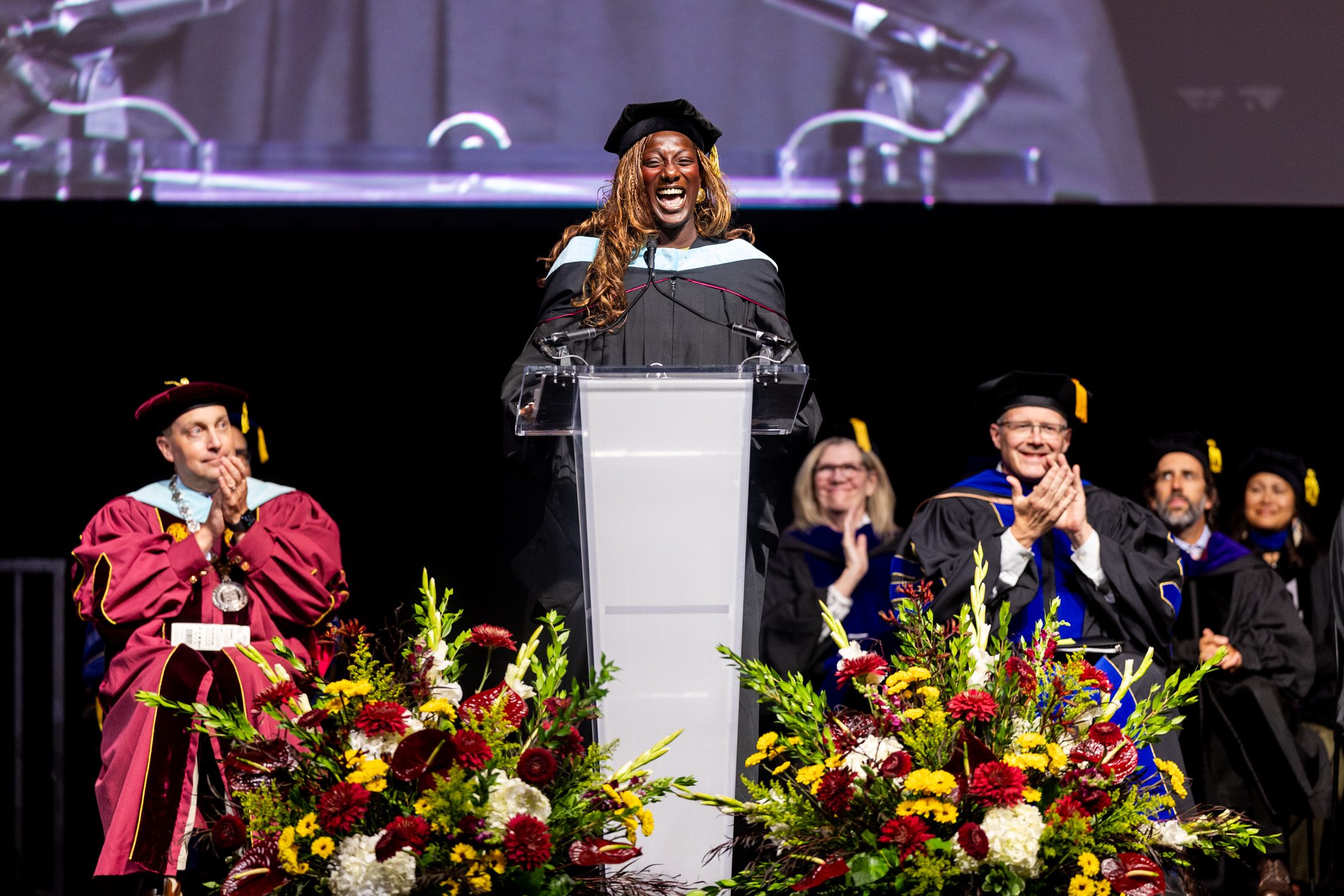 Abena Boamah-Acheampong (MEd '18) addresses the Class of 2029 as the keynote speaker during New Student Convocation. Boamah-Acheampong is the founder and CEO of HanaHana Beauty Company.