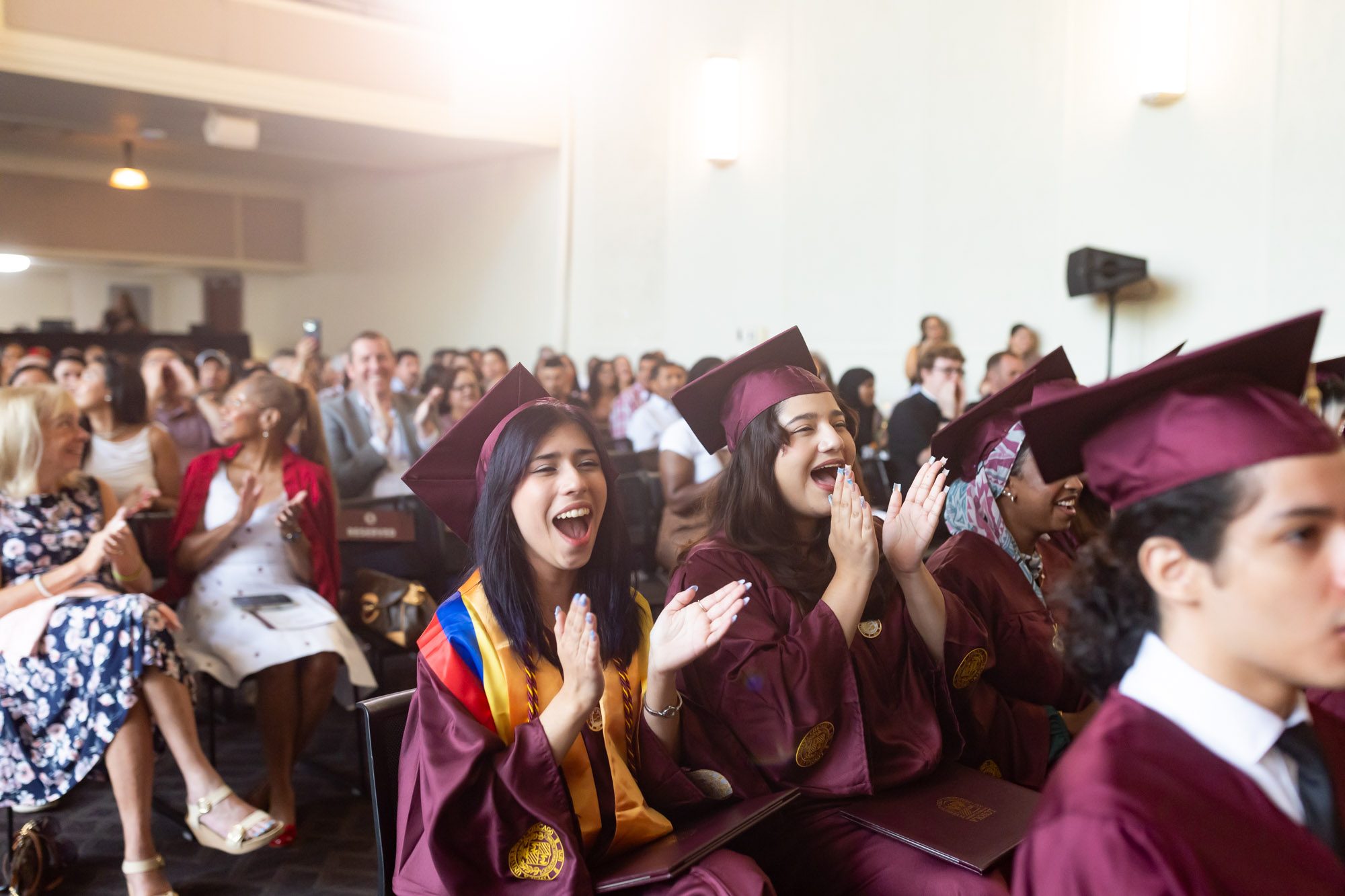 Arrupe College students celebrate along with their friends and family during commencement. Former Loyola president Fr. Michael Garanzini, who helped launch the school in 2016, served as the commencement speaker.