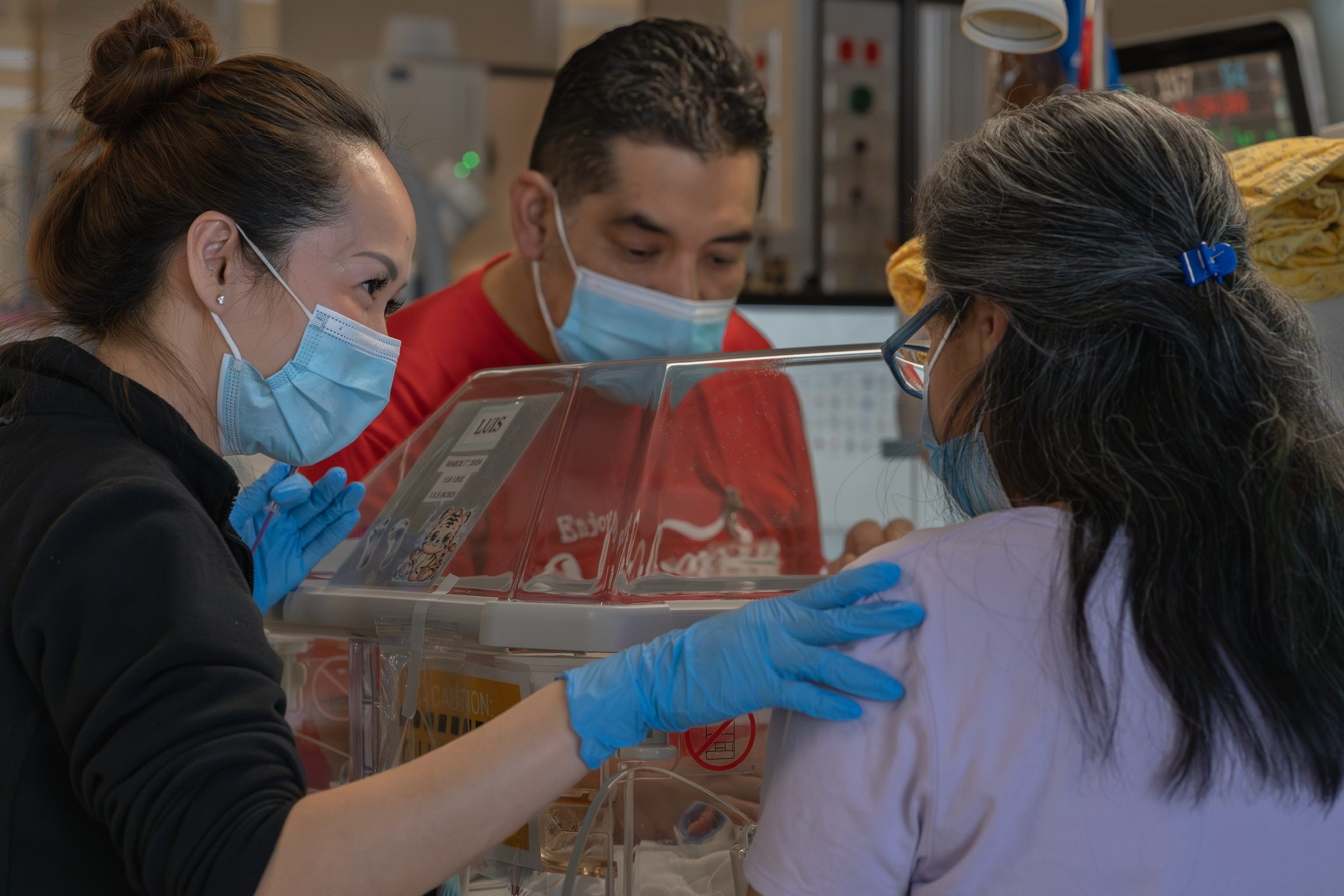 Header image and image above: Assistant Professor Thao Griffith, seen at left supporting patients in the NICU, is researching how early life stress compromises oral feeding skill development in preterm infants.