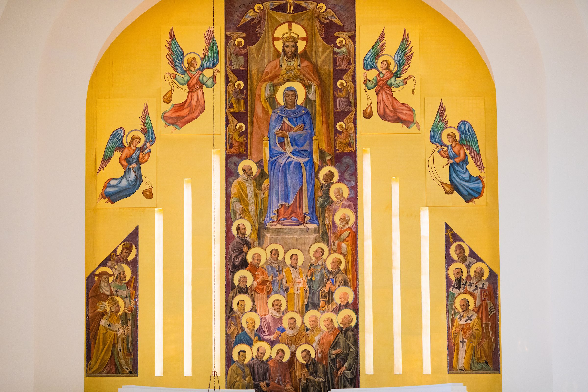 Fr. Overbeck illuminates the history behind other spaces and pieces of art within the Madonna della Strada, including the large mosaic at the front of the chapel depicting Jesus, Mary, and other Jesuit figures.