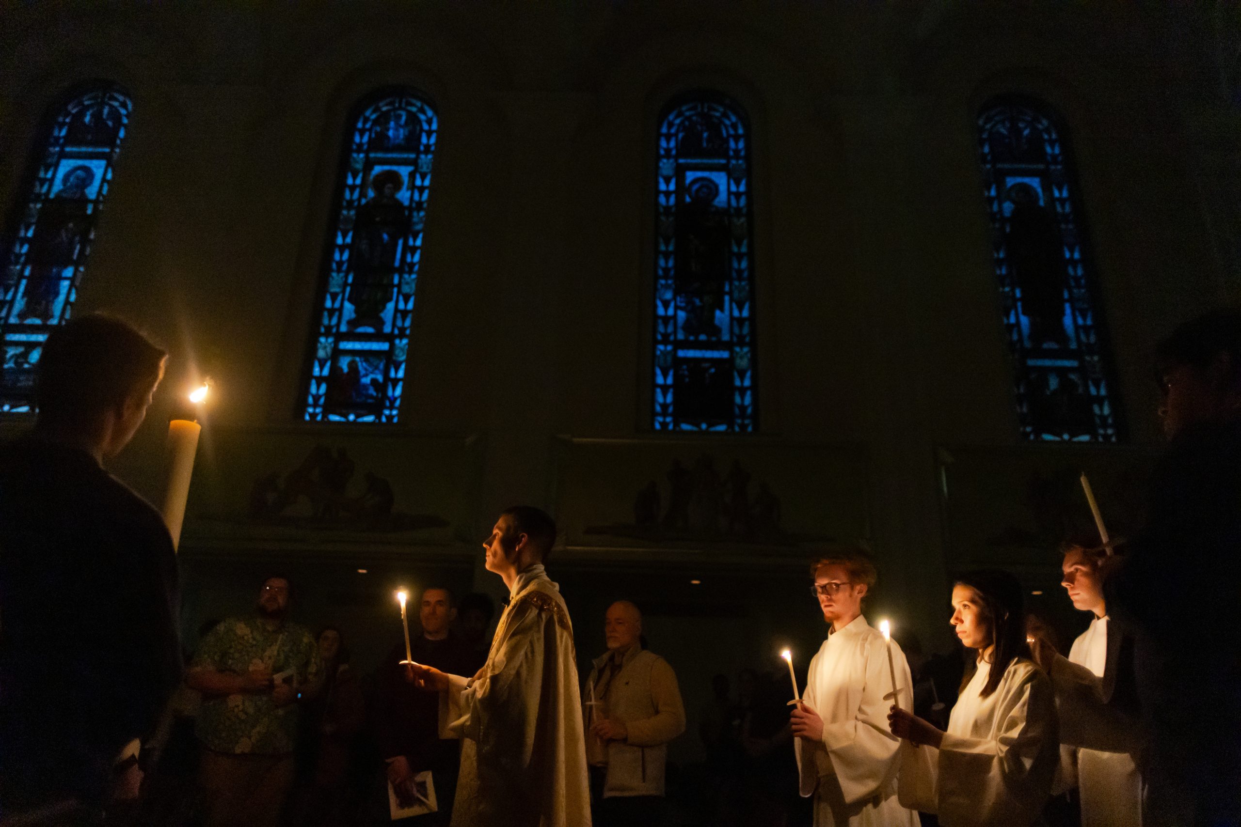 During the Easter Vigil priests anoint the foreheads of the confirmands with chrism oil.