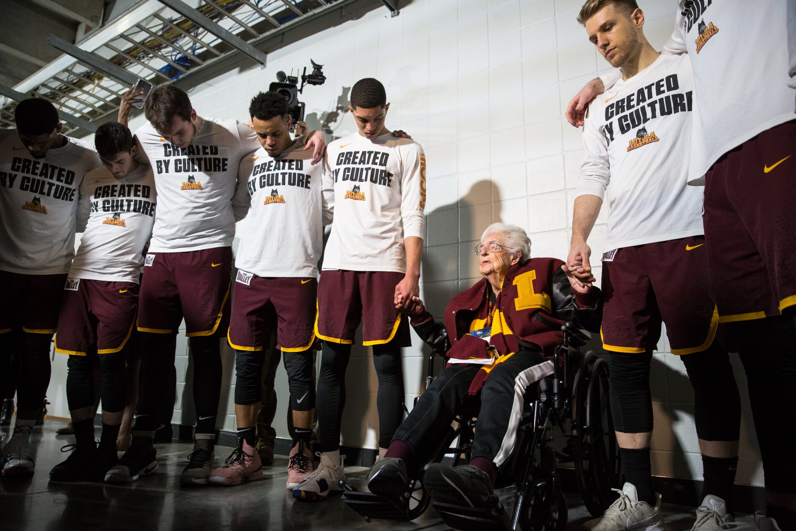 Sister Jean Dolores Schmidt, BVM, leads Loyola University Chicago players in prayer before competing in the Elite Eight round in the NCAA Tournament against Kansas State at Philips Arena in Atlanta, on March 24, 2018. (Courtesy Loyola University Chicago)