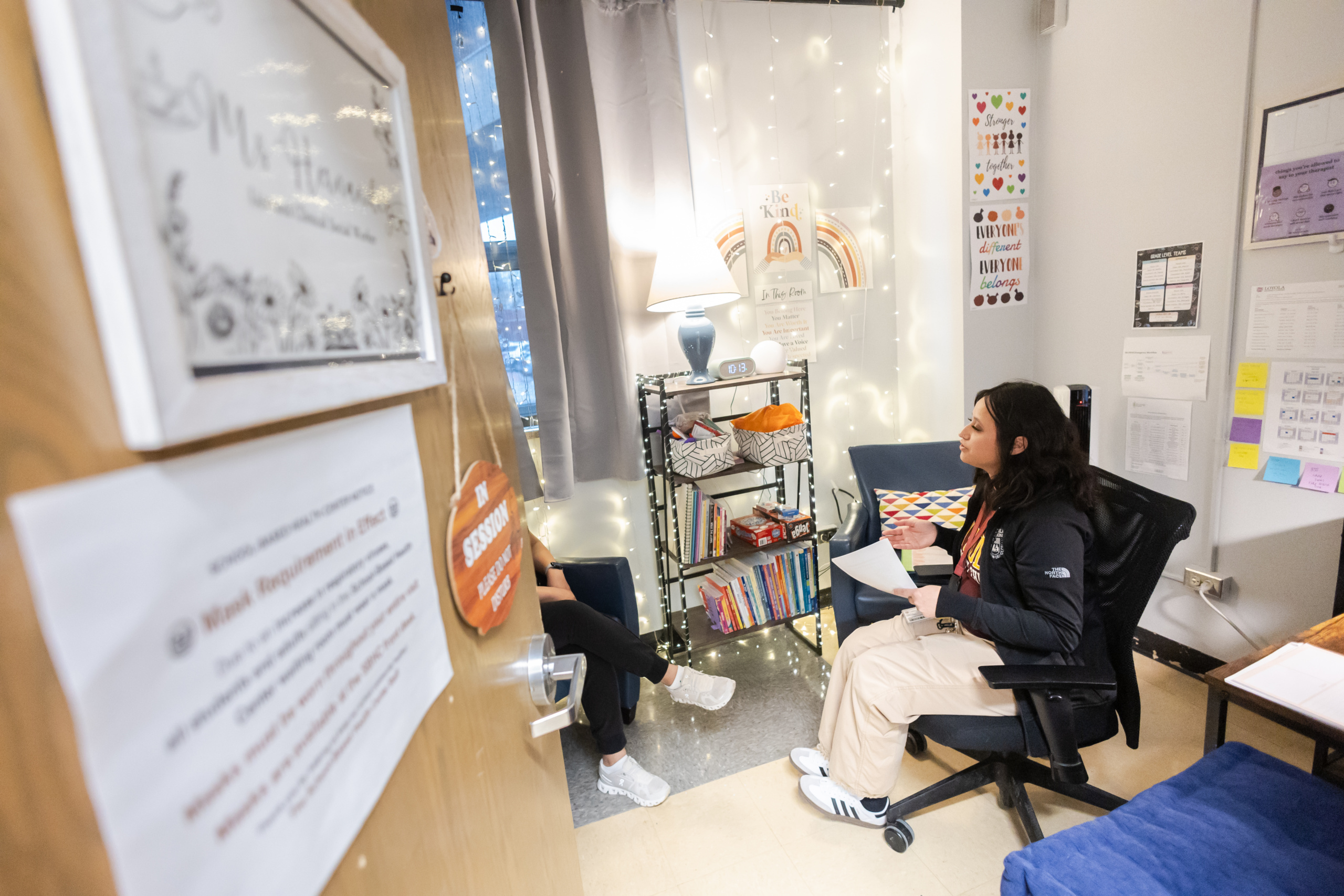 Marcela Hernandez, a Licensed Clinical Social Worker, speaks with a patient in the School-Based Health Center (SHBC) at Proviso East.
(Photo: Lukas Keapproth)