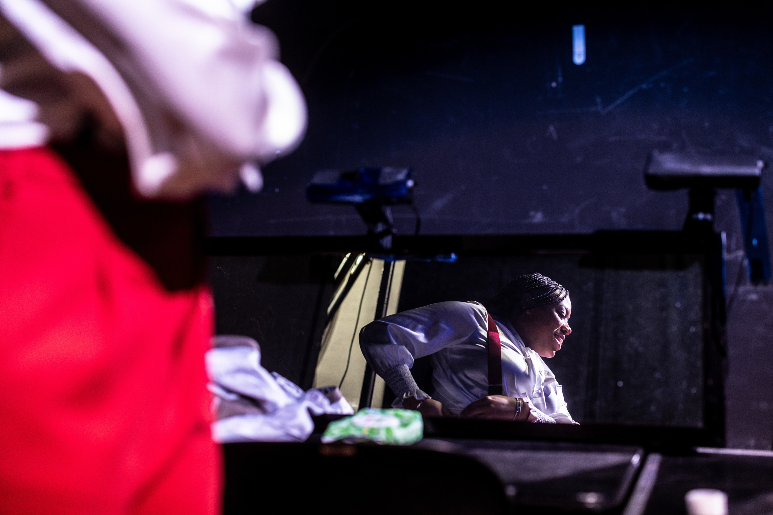 Saniah Johnson prepares backstage during a dress rehearsal for 
