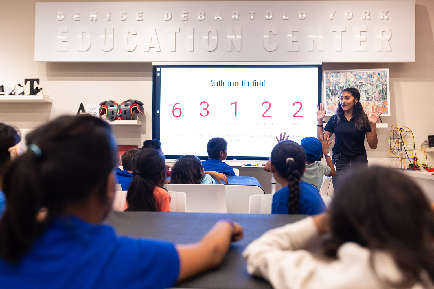 Students in the 49ers STEM Leadership Institute listen to a teacher presenting a math lesson at Levi's Stadium on September 26, 2025.
