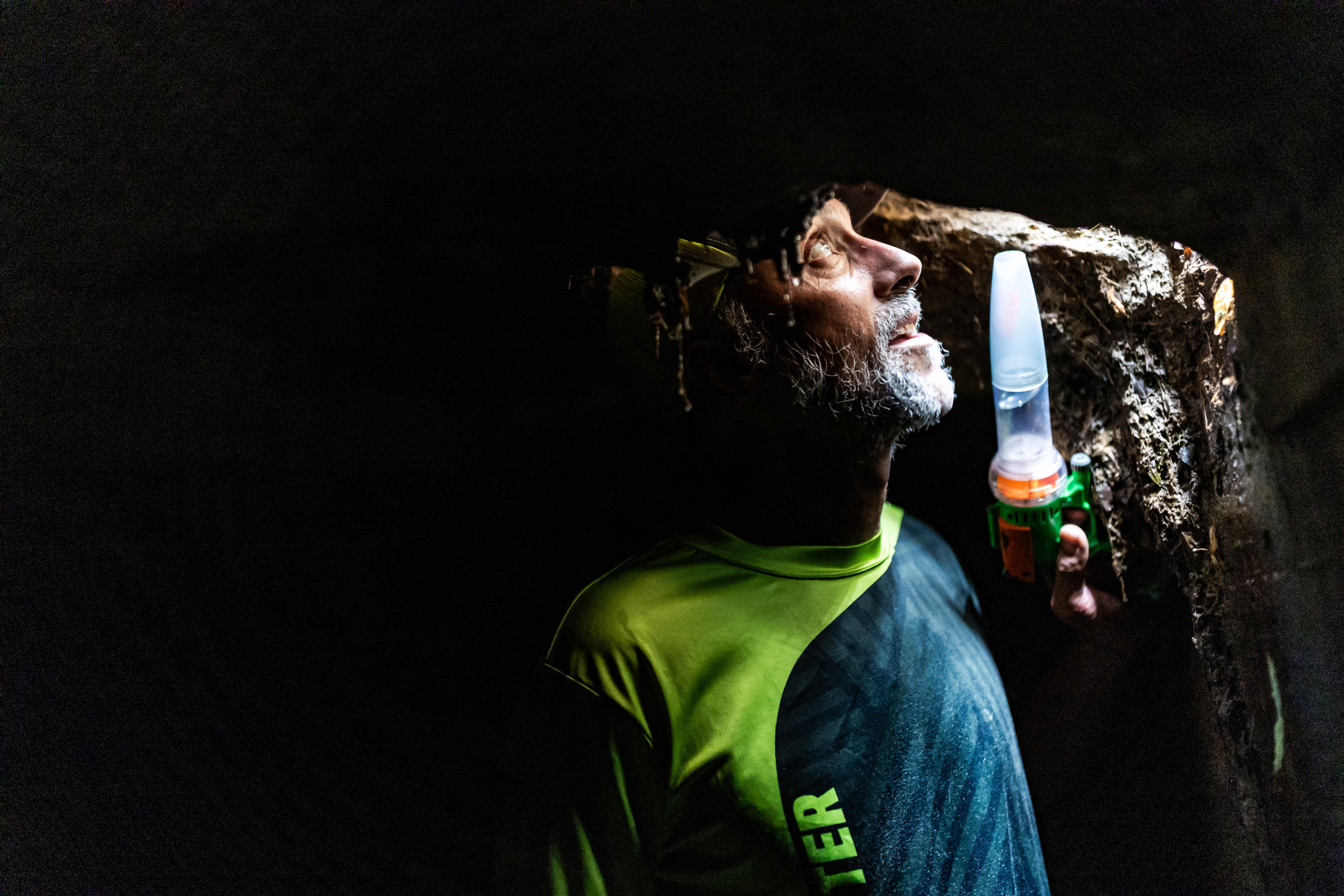 Justin Harbison, associate professor for the Parkinson School of Health Sciences and Public Health, explores a sewer drain in Des Plaines, where he studies mosquito populations and groundwater management.