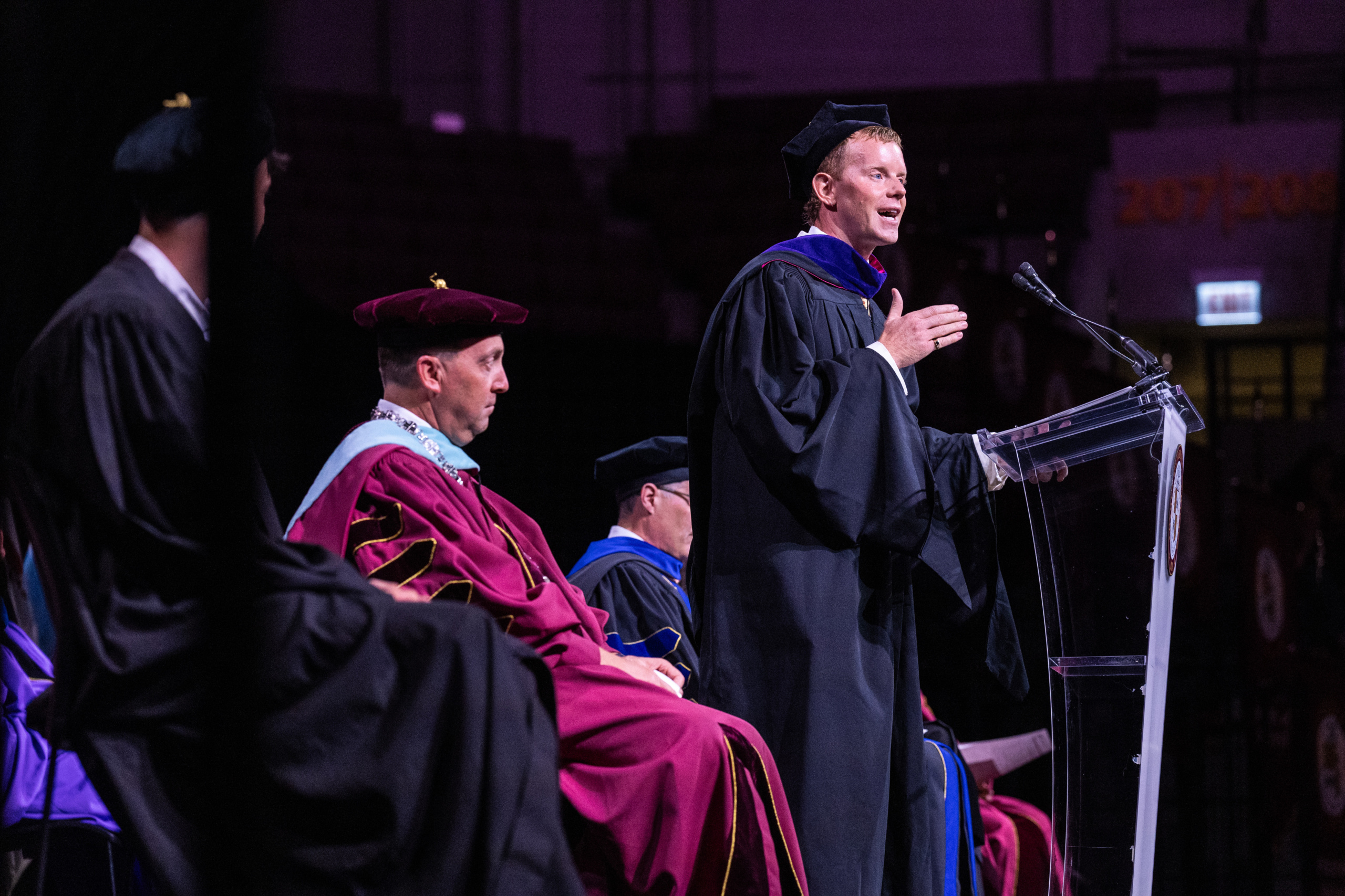 George McGraw (BA ’09) speaks to the Class of 2030 during New Student Convocation. 