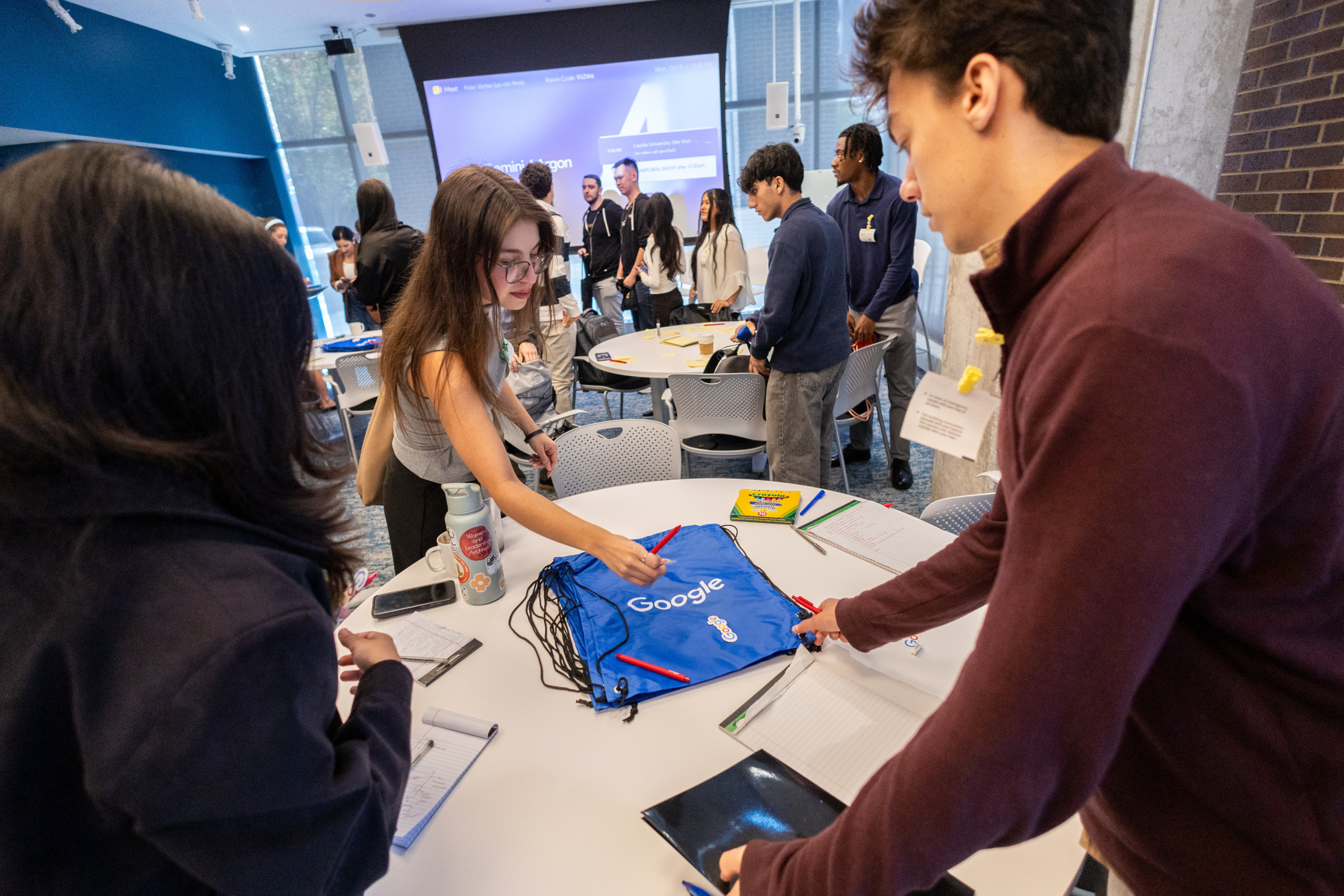 Loyola students take some swag during their visit Google's Chicago headquarters in the Fulton Market District on a career tour of the facility.